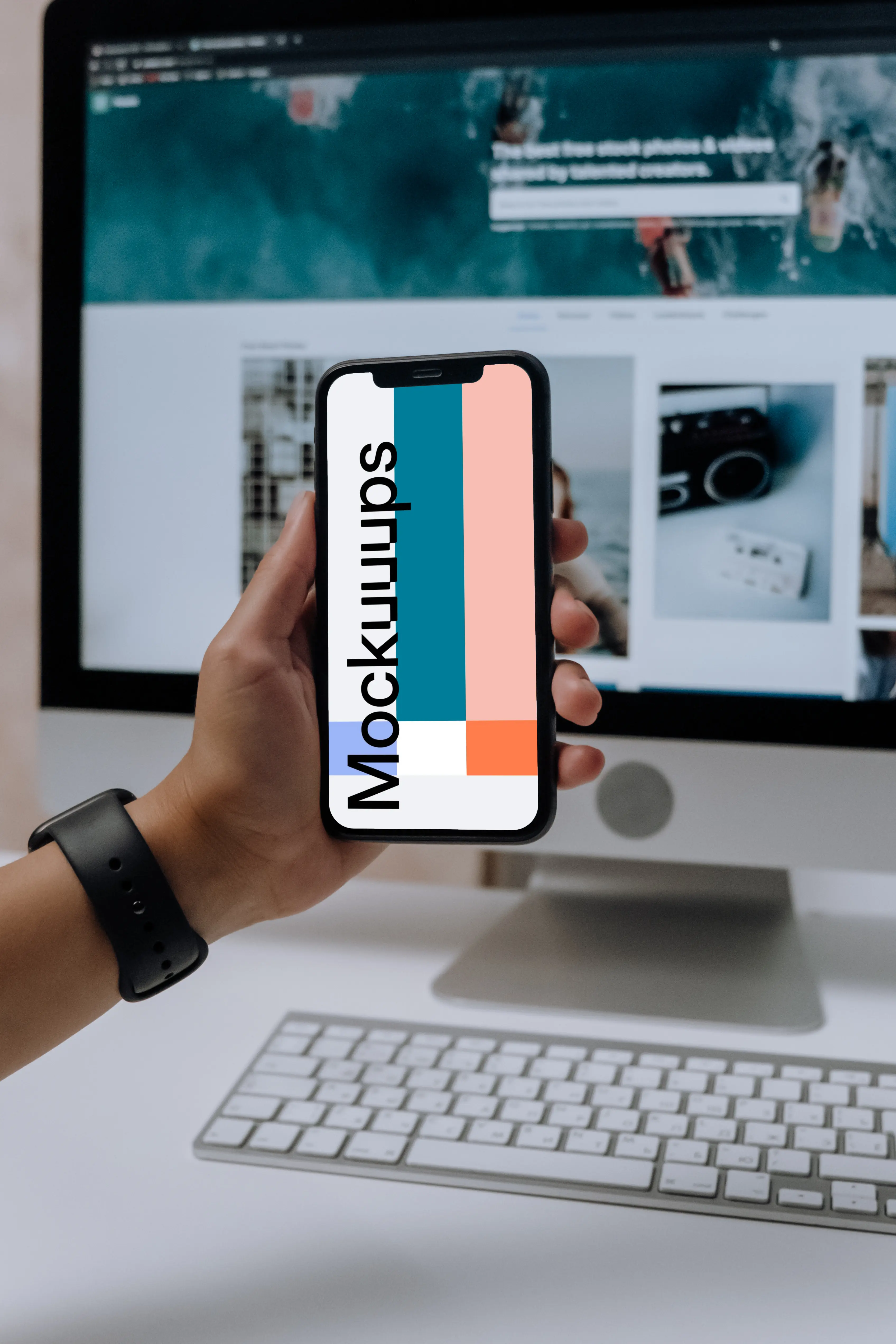 Hand holding an iPhone 12 mockup