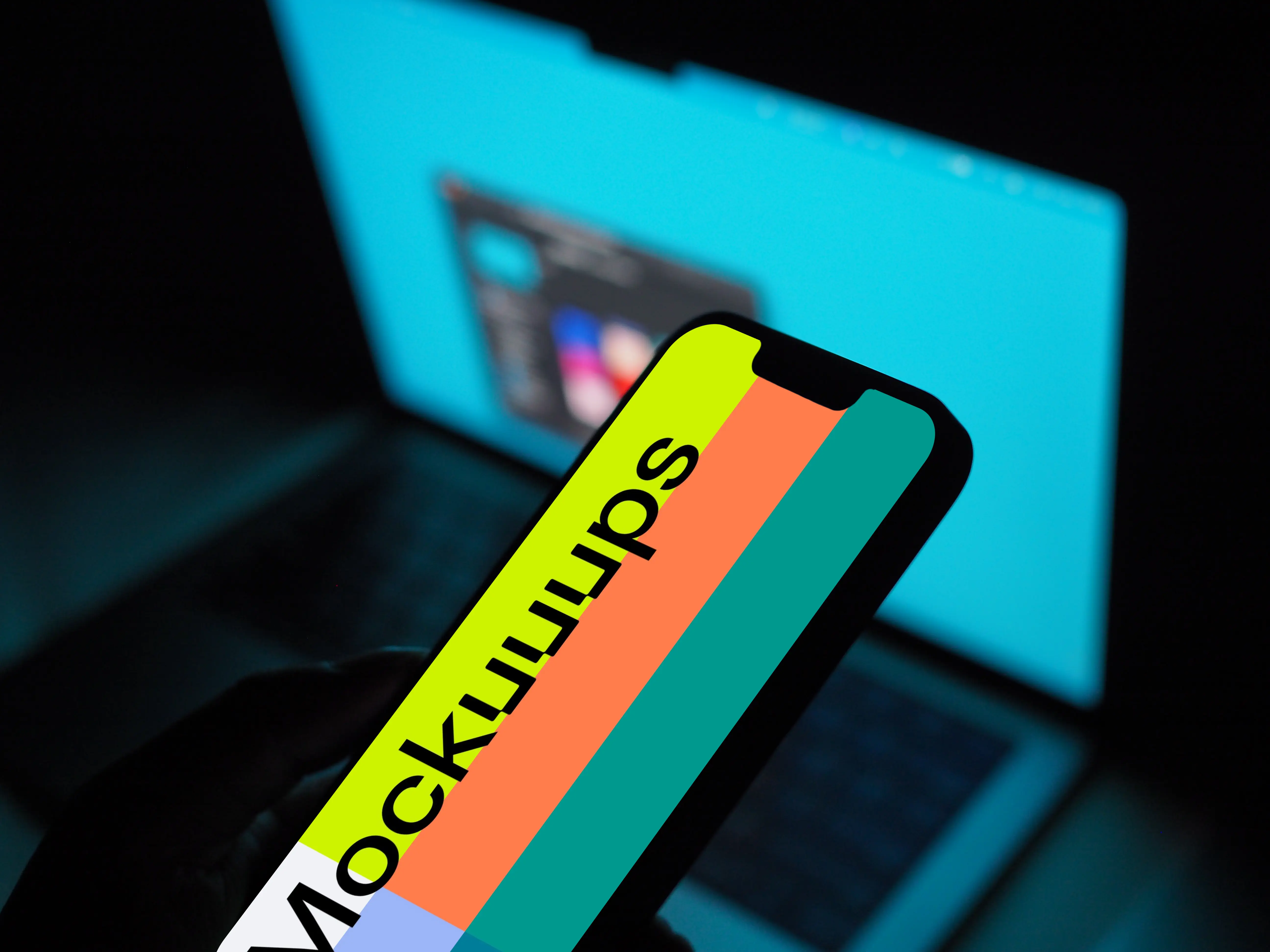 Hand holding an iPhone 13 mockup