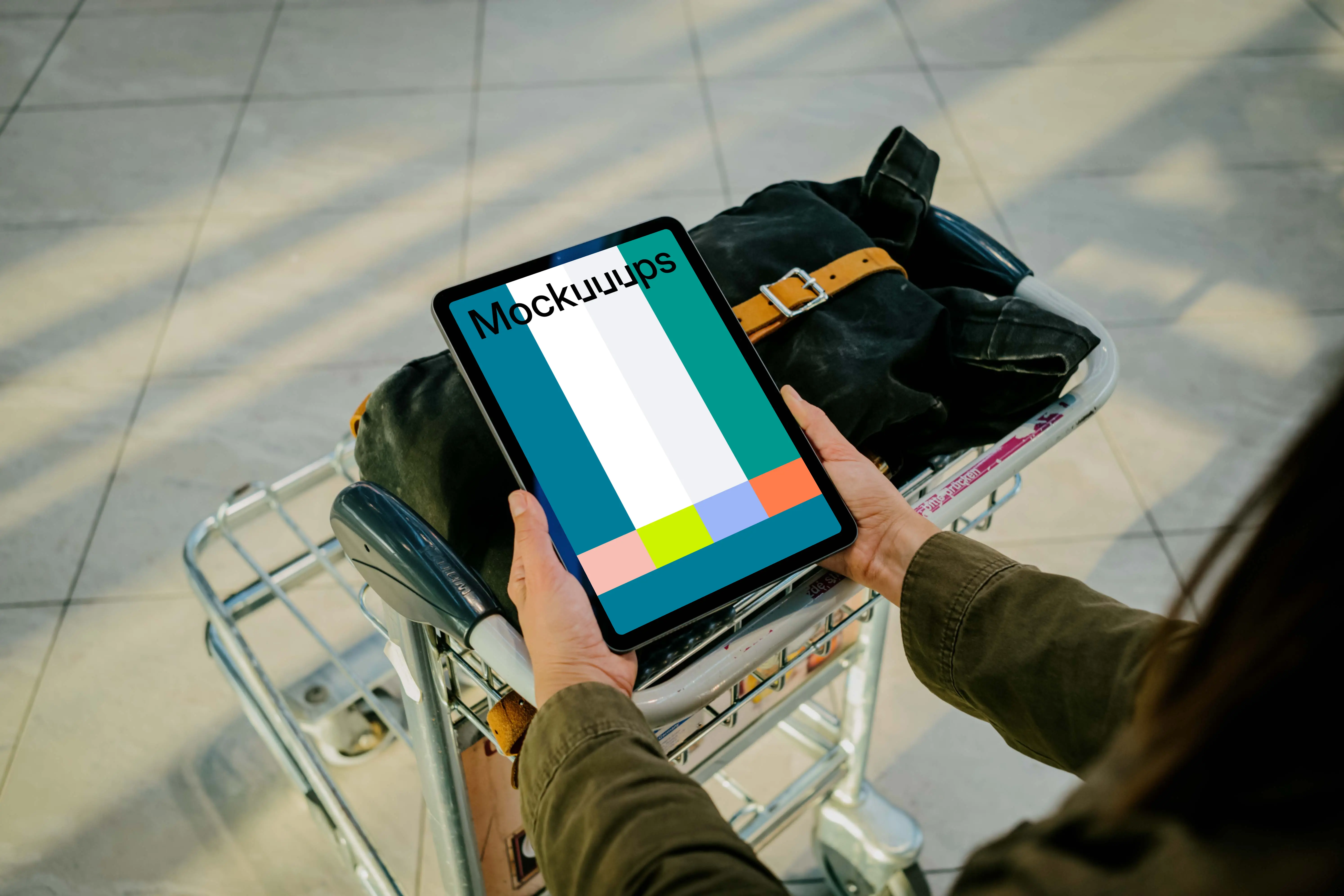 Hands holding an iPad Air mockup