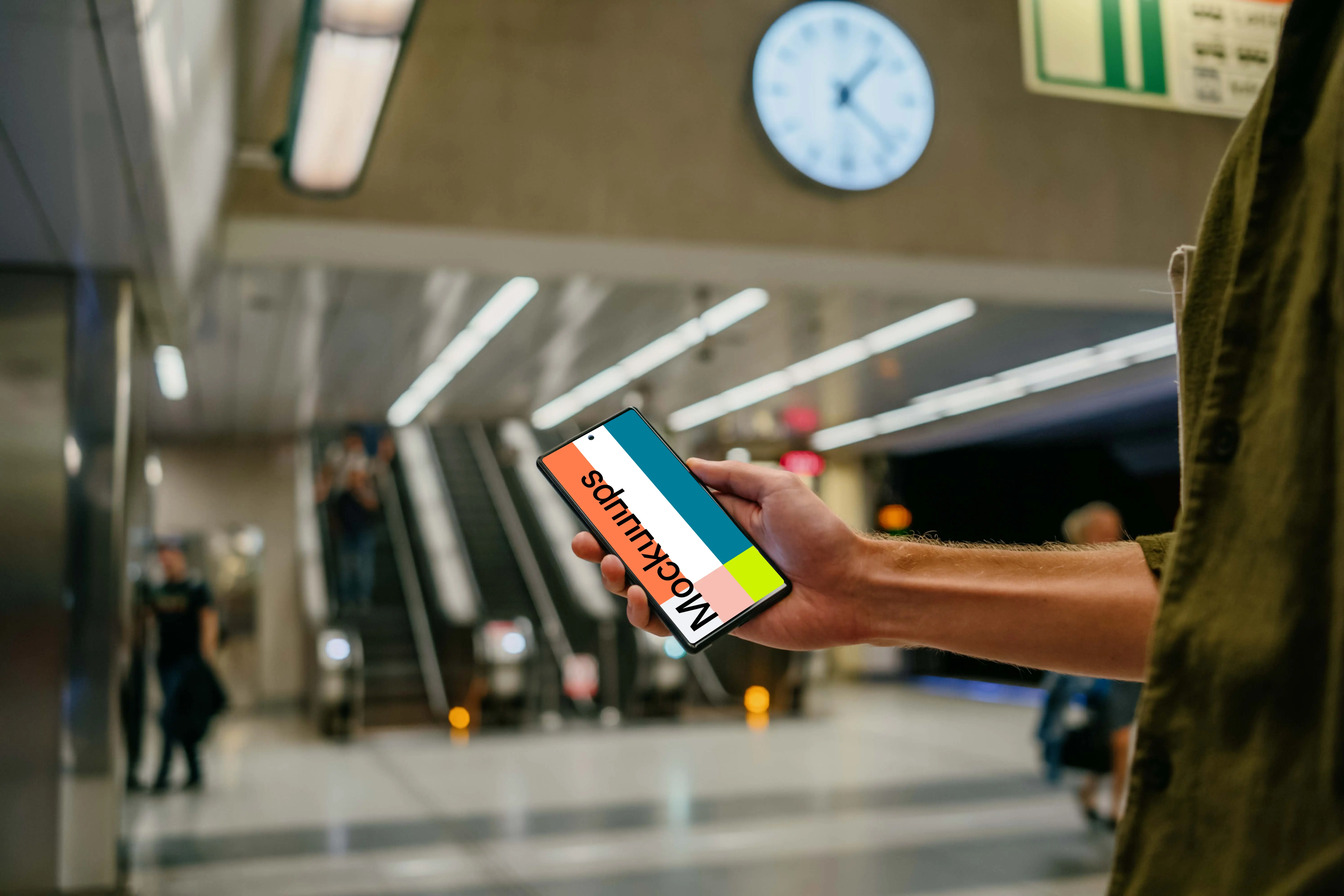 Holding a Google Pixel 6 mockup at the subway station
