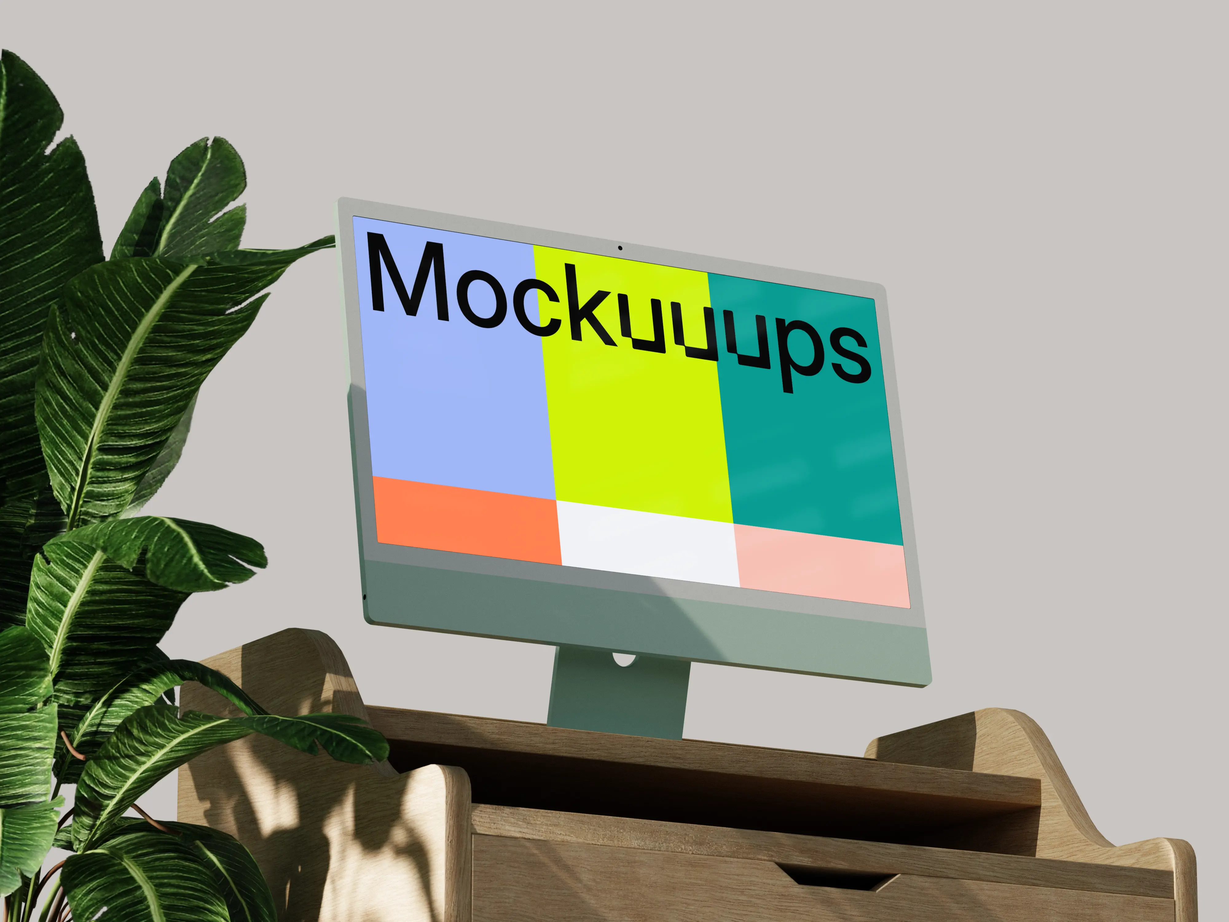 iMac mockup on a wooden desk with indoor plant