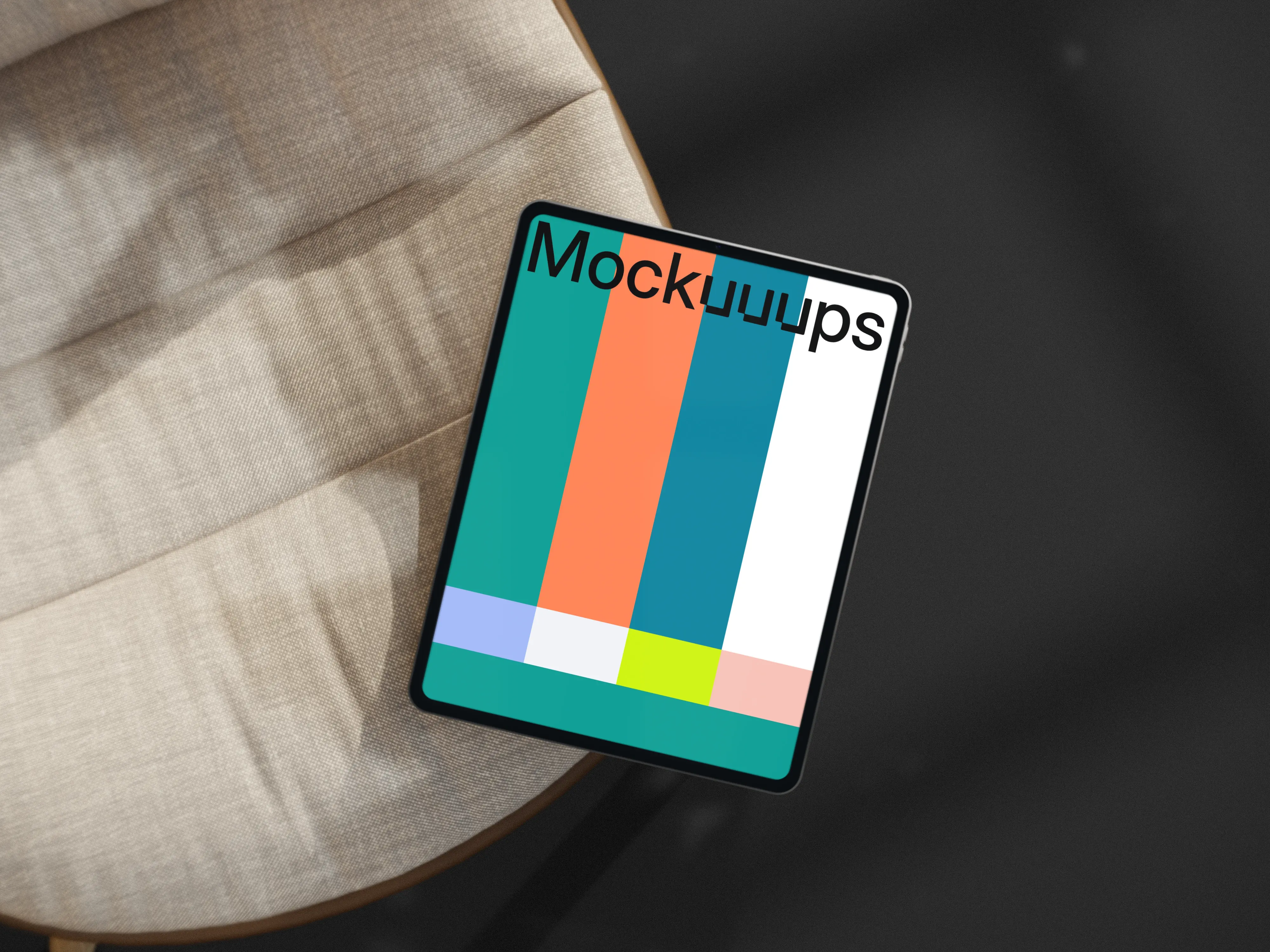 iPad Pro mockup on a modern fabric chair