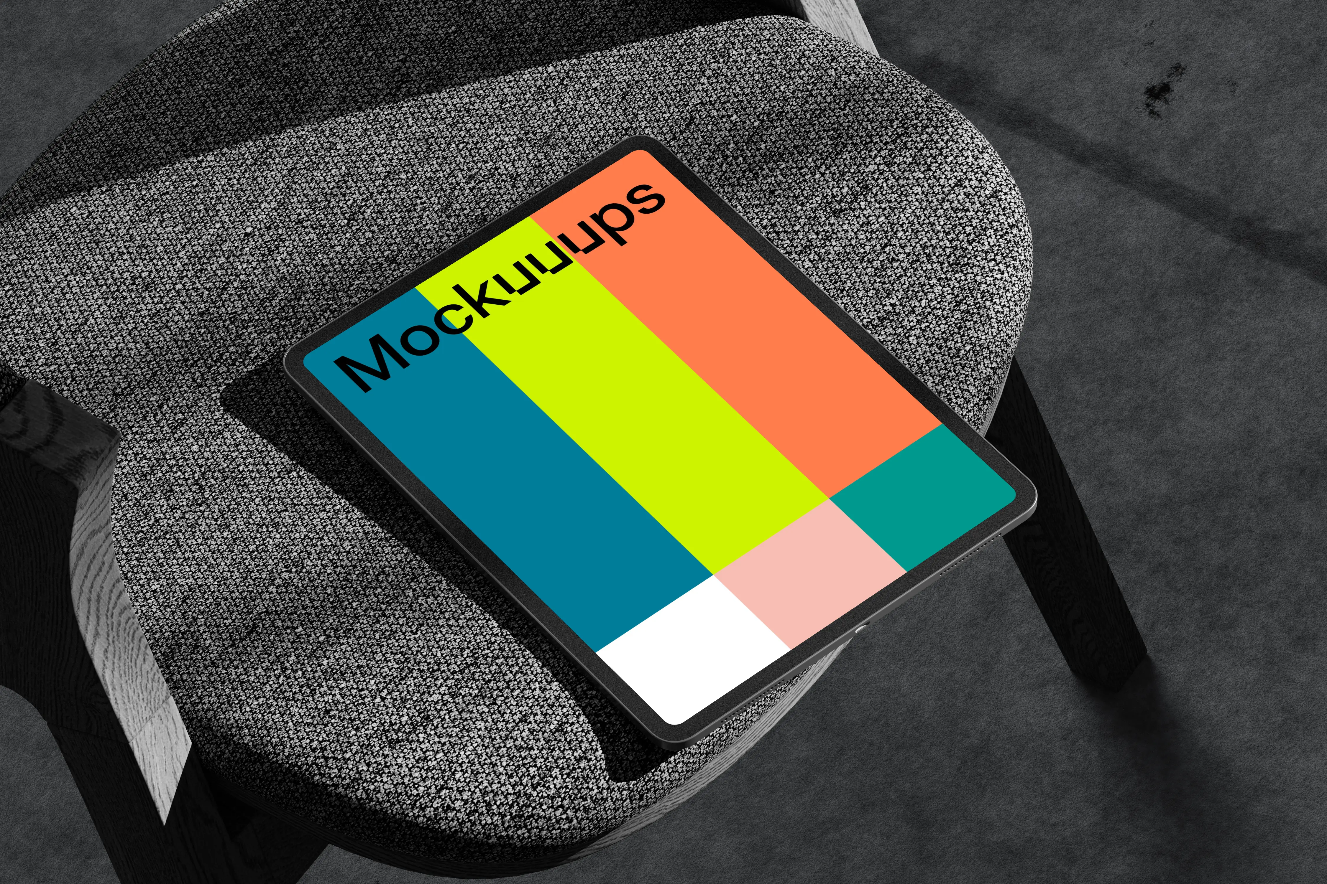 iPad Pro mockup on textured armchair with shadow play