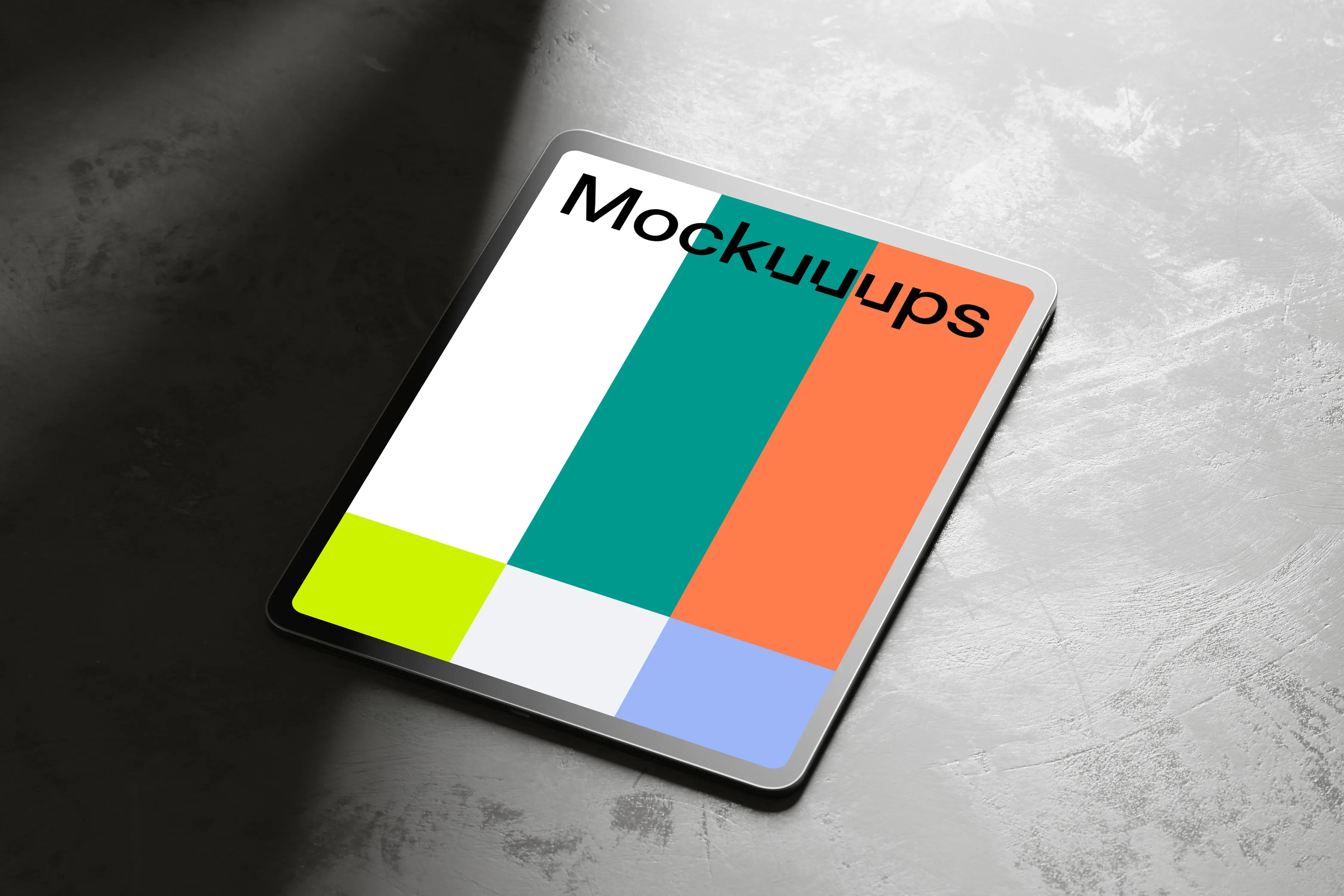 iPad Pro mockup on textured rock surface with dramatic shadows