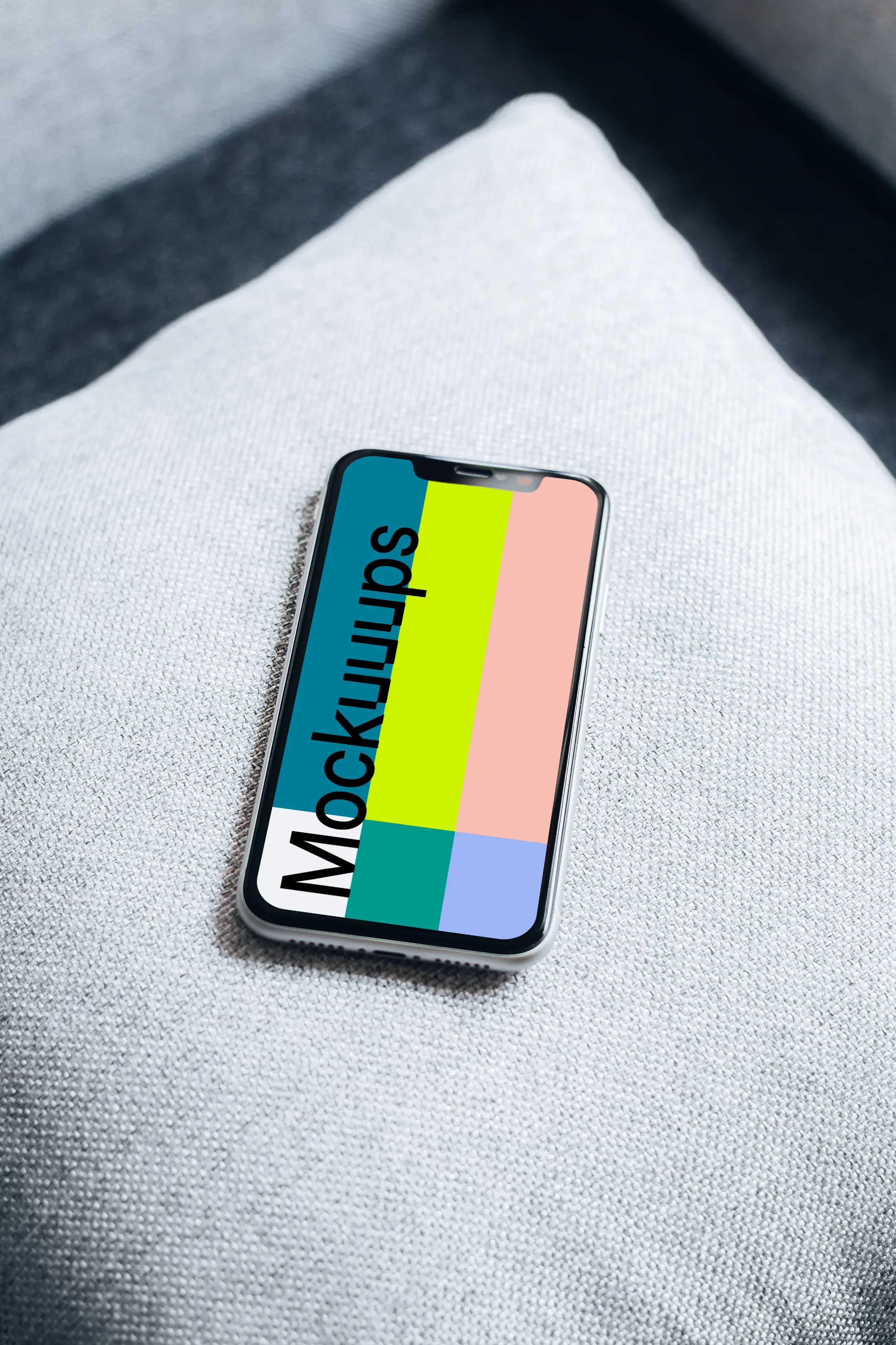 iPhone 11 mockup on pillow