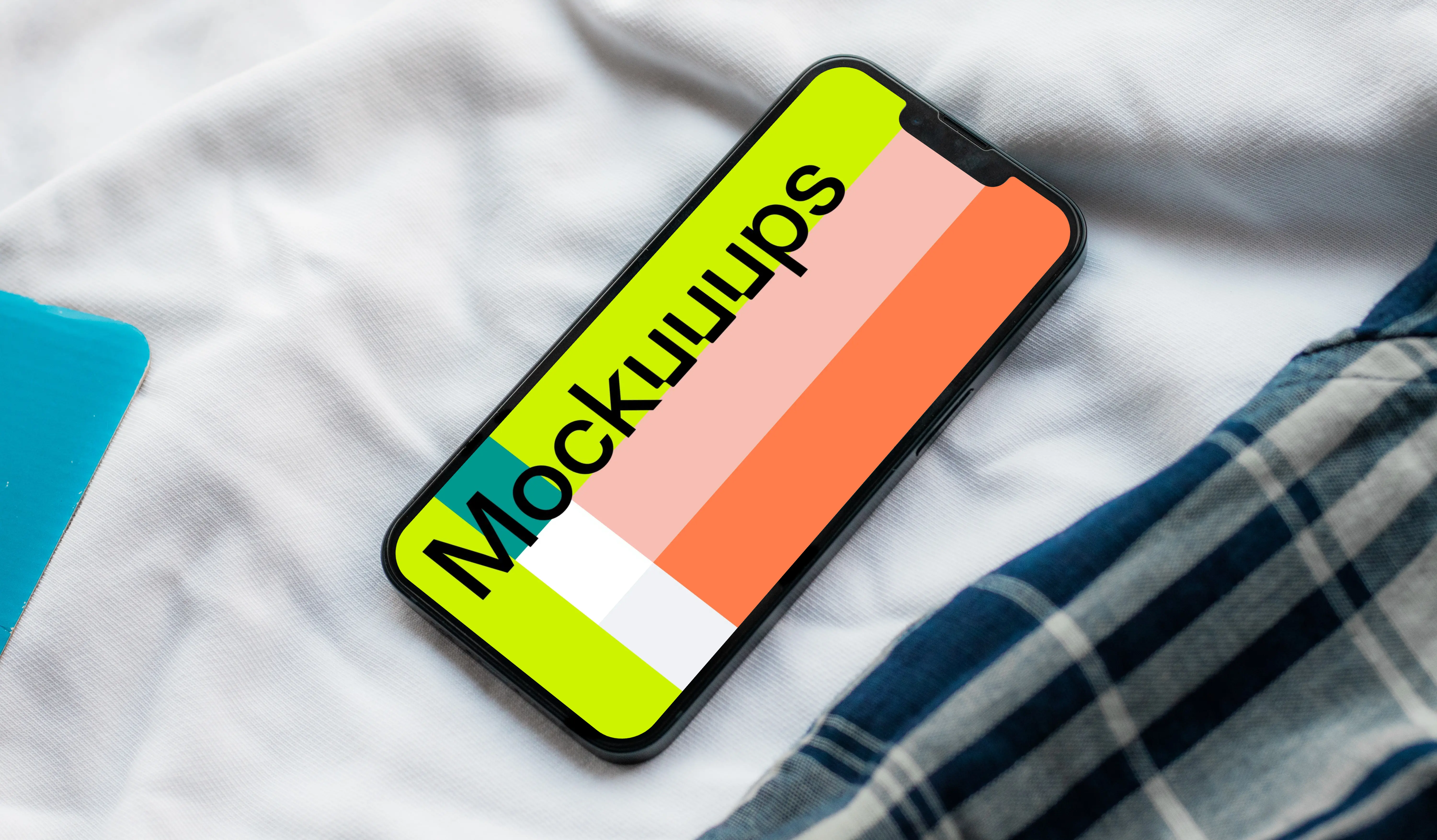 iPhone 13 mockup on bed