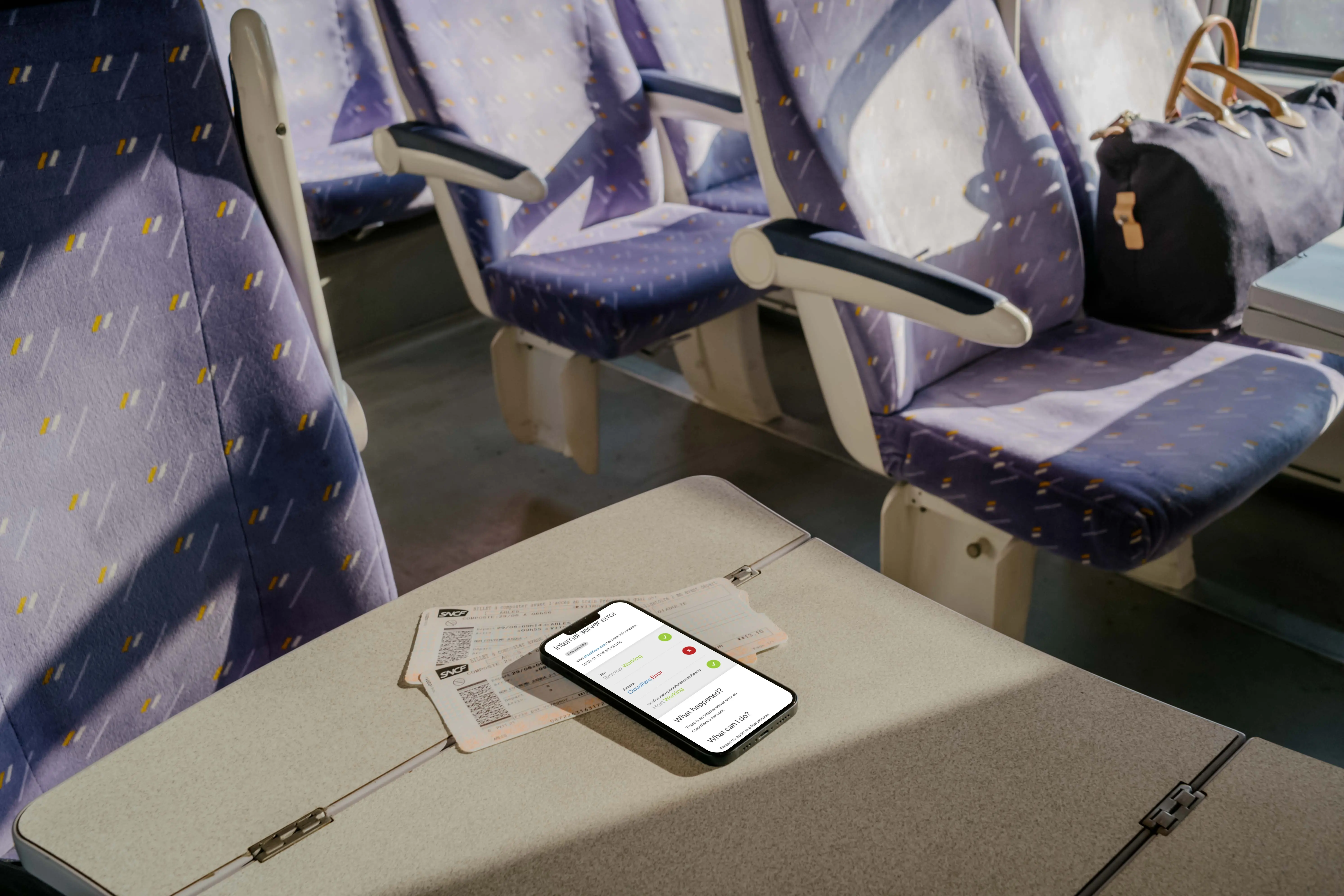 iPhone 13 mockup on table in train 