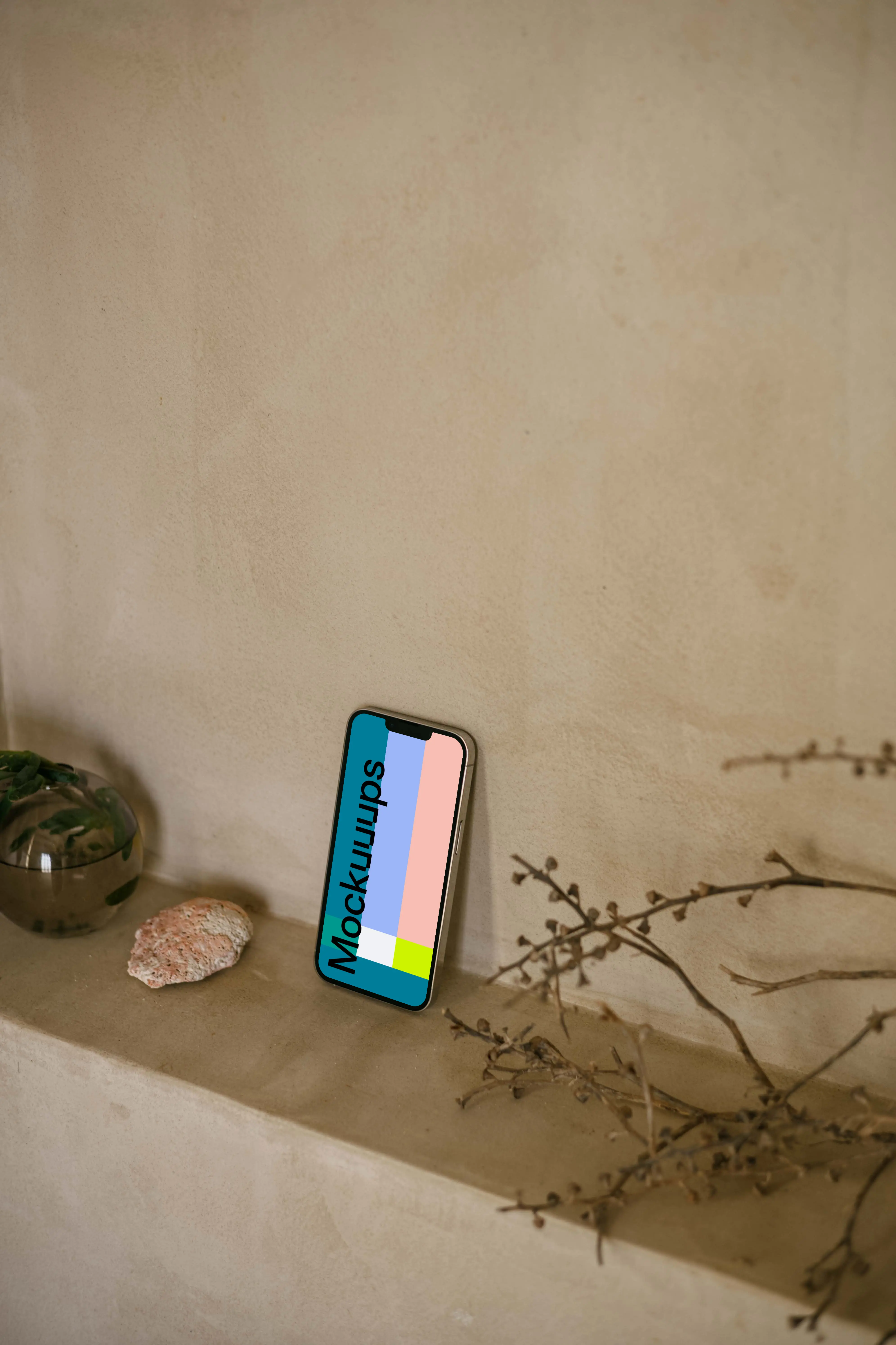 iPhone 13 Pro mockup next to a teapot and plant