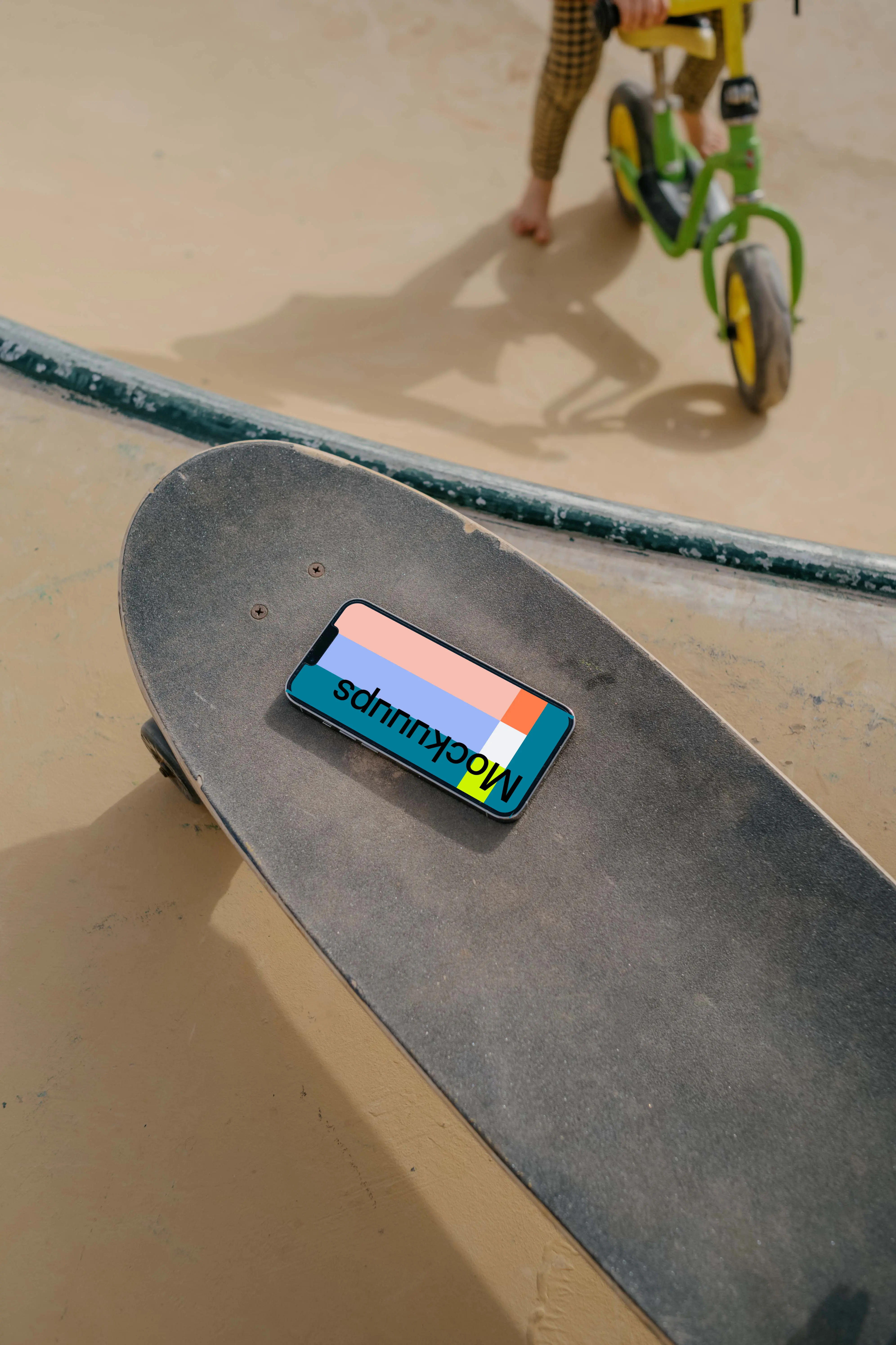  iPhone 13 Pro mockup on a skateboard