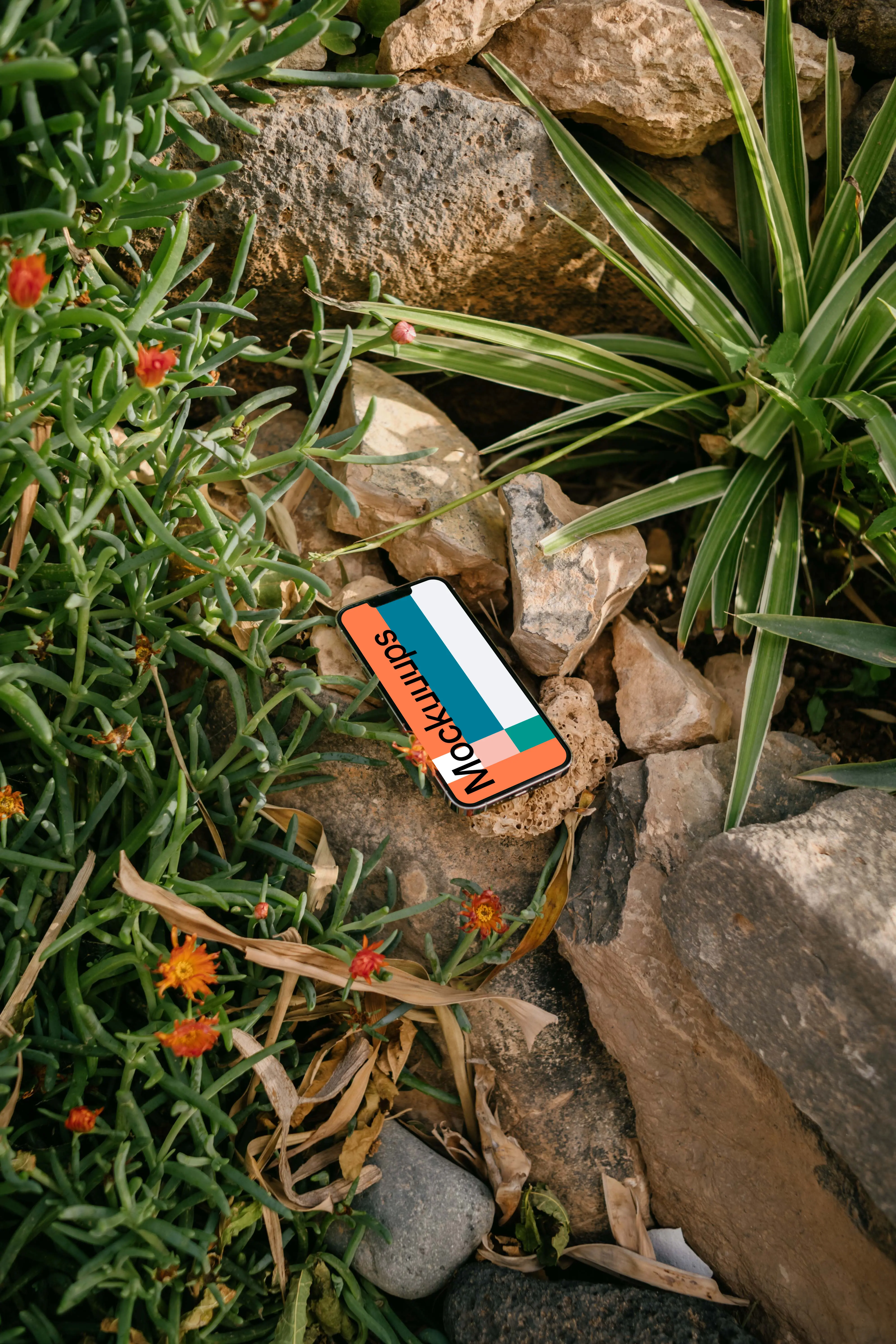 iPhone 13 Pro mockup placed in a garden