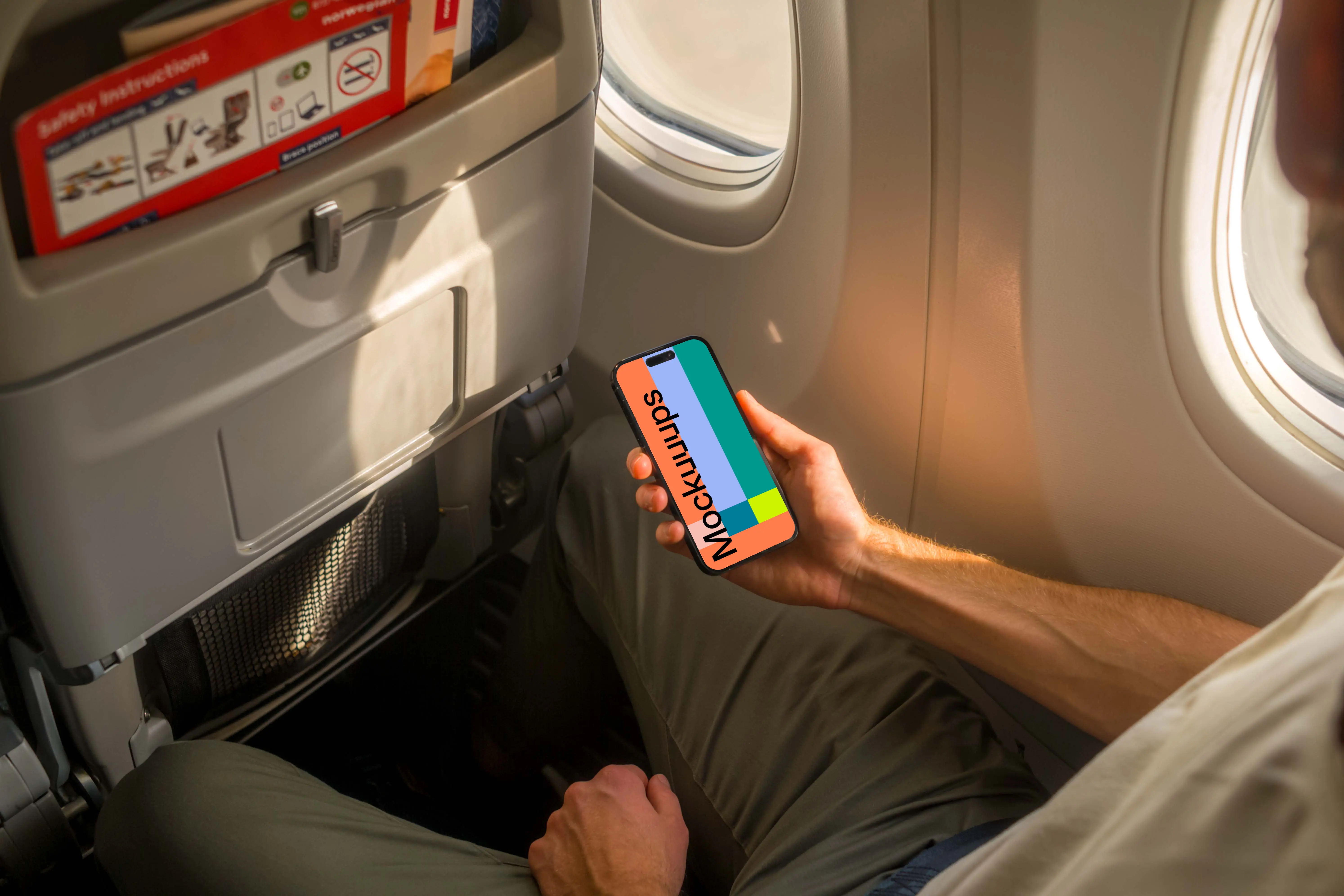 Free iPhone 14 Pro on a Plane Mockup