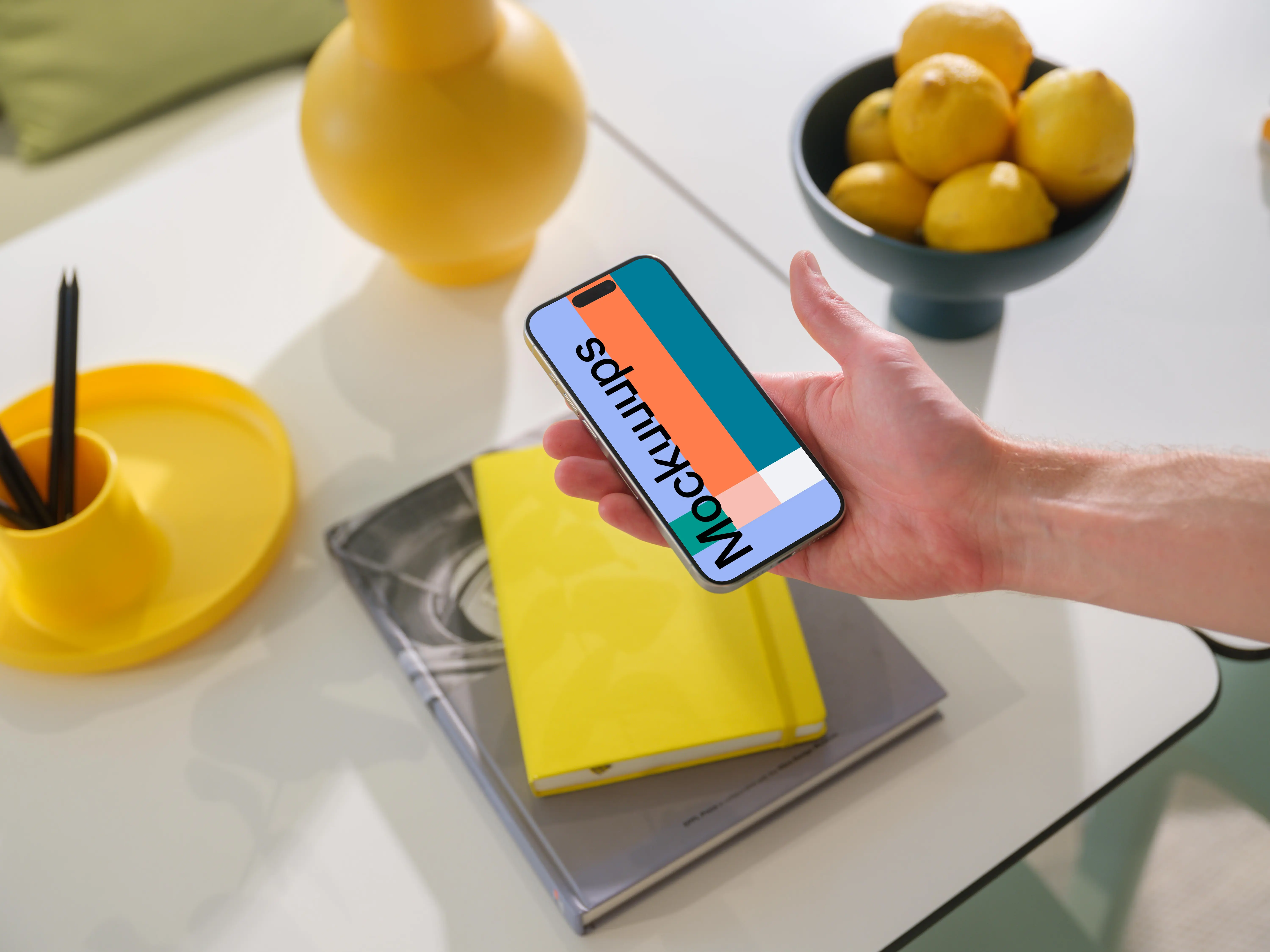 iPhone 15 Pro mockup in a vibrant creative setting