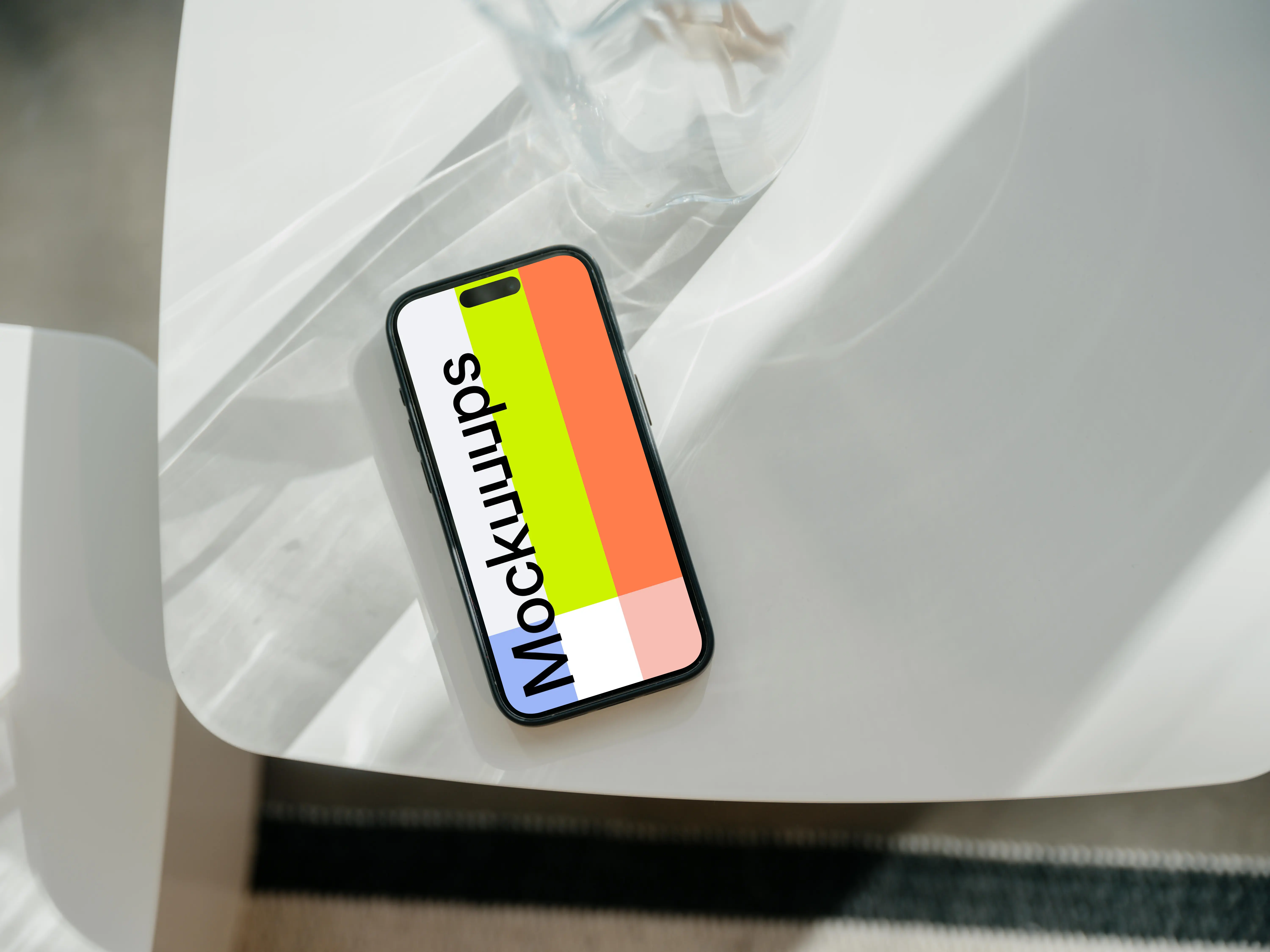 iPhone 15 Pro mockup on a white modern table