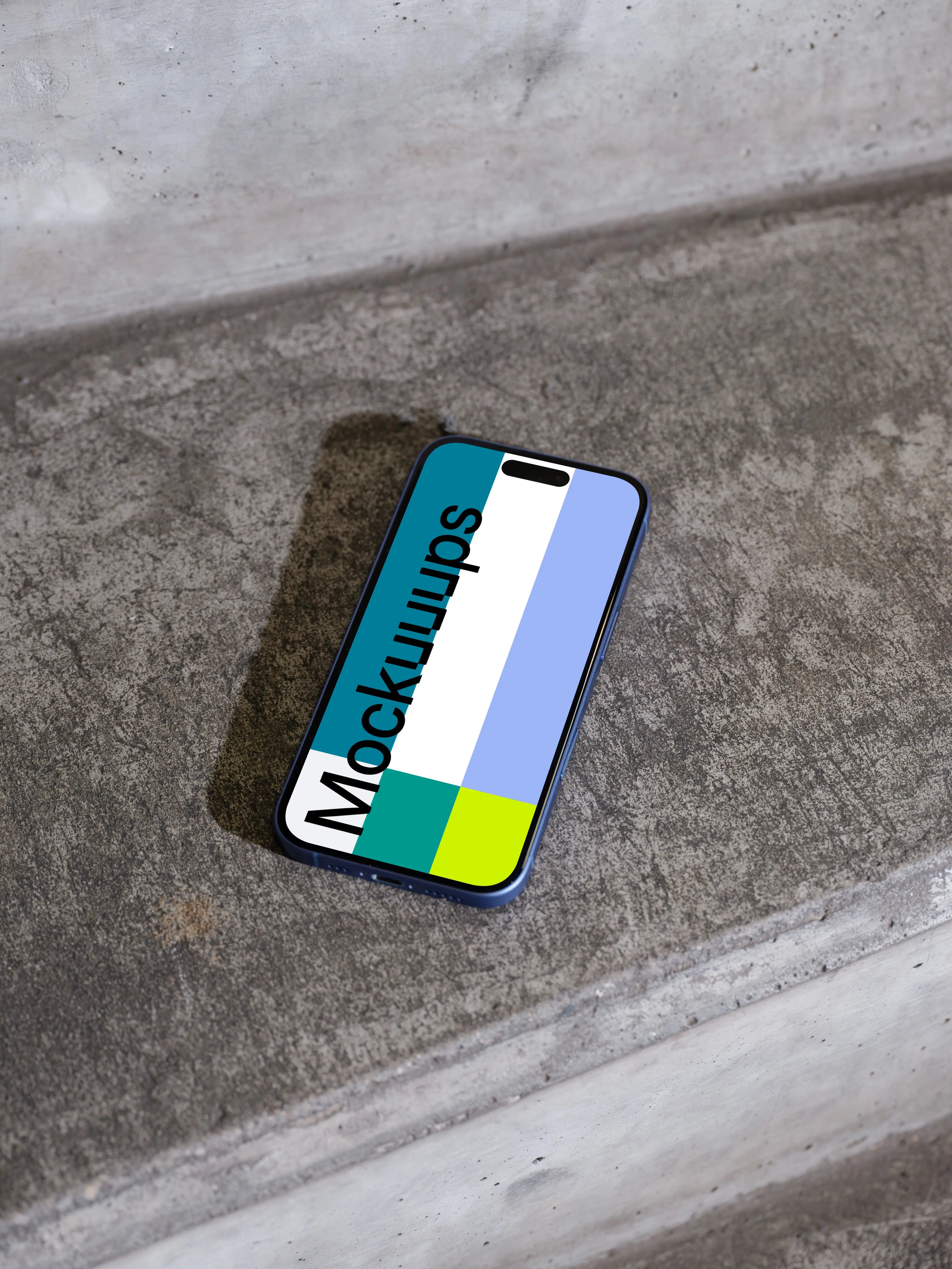 iPhone 16 mockup on a concrete surface