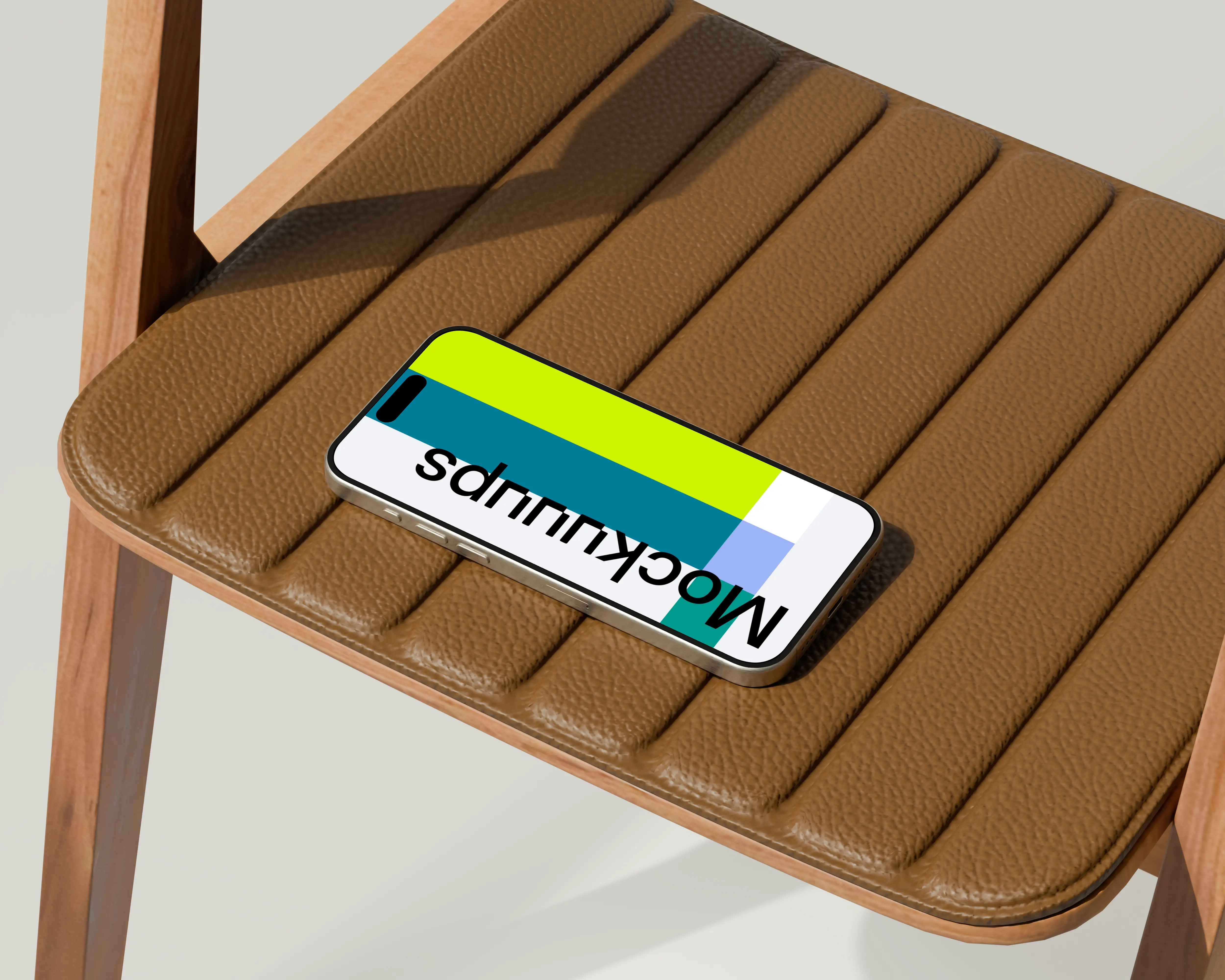 iPhone 16 mockup on a leather chair