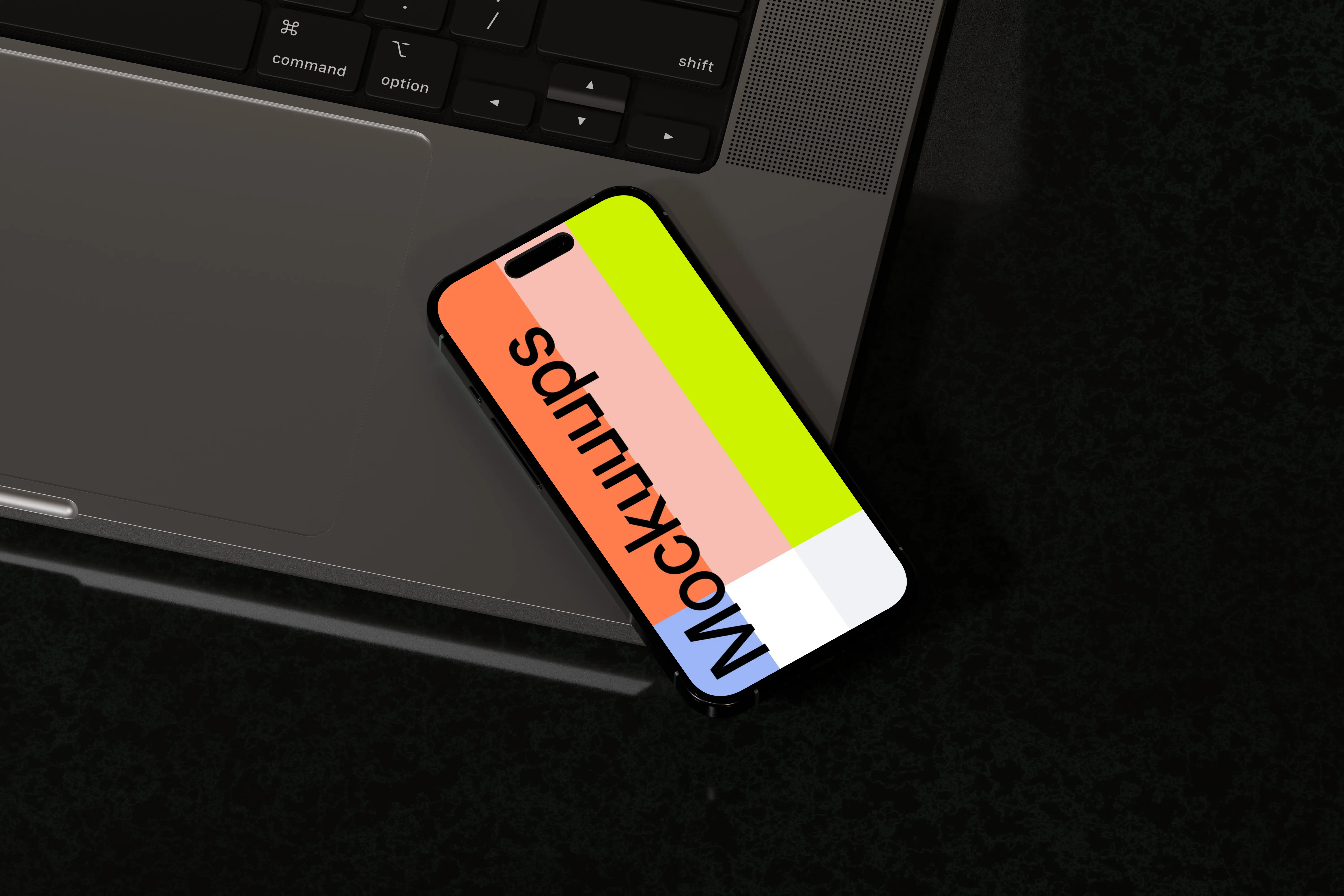 iPhone 16 mockup with laptop on black surface