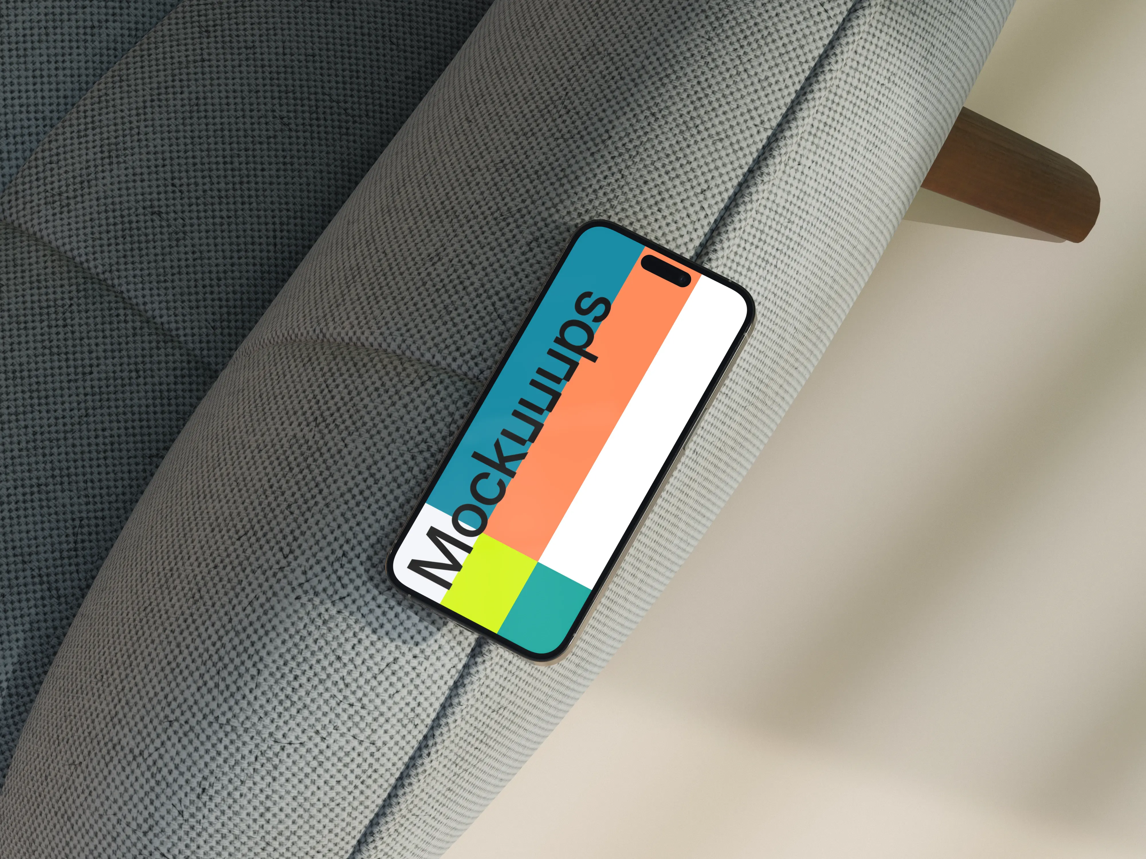 iPhone mockup on a modern fabric sofa