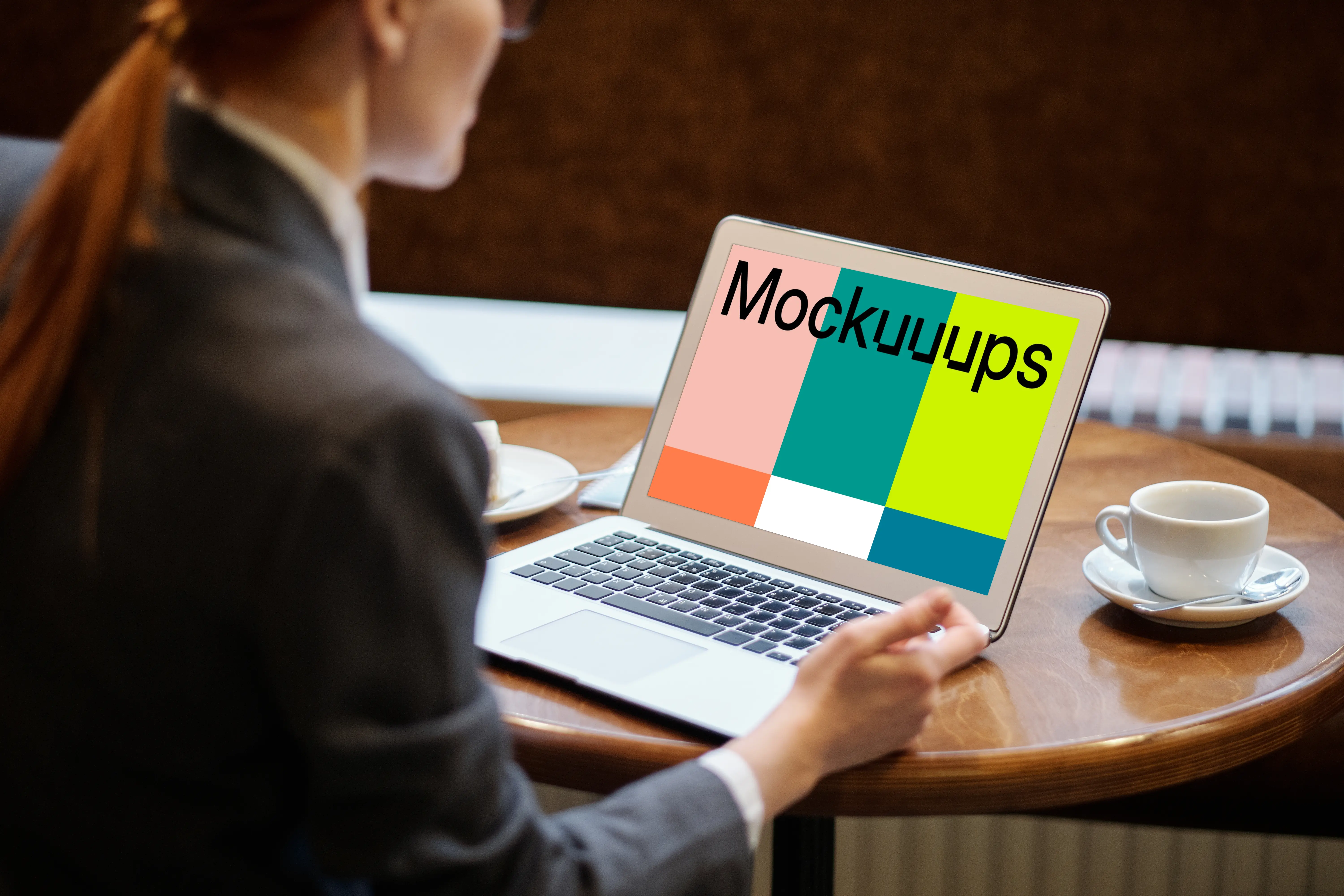 Lady using a MacBook Air mockup with a cup of coffee at the side