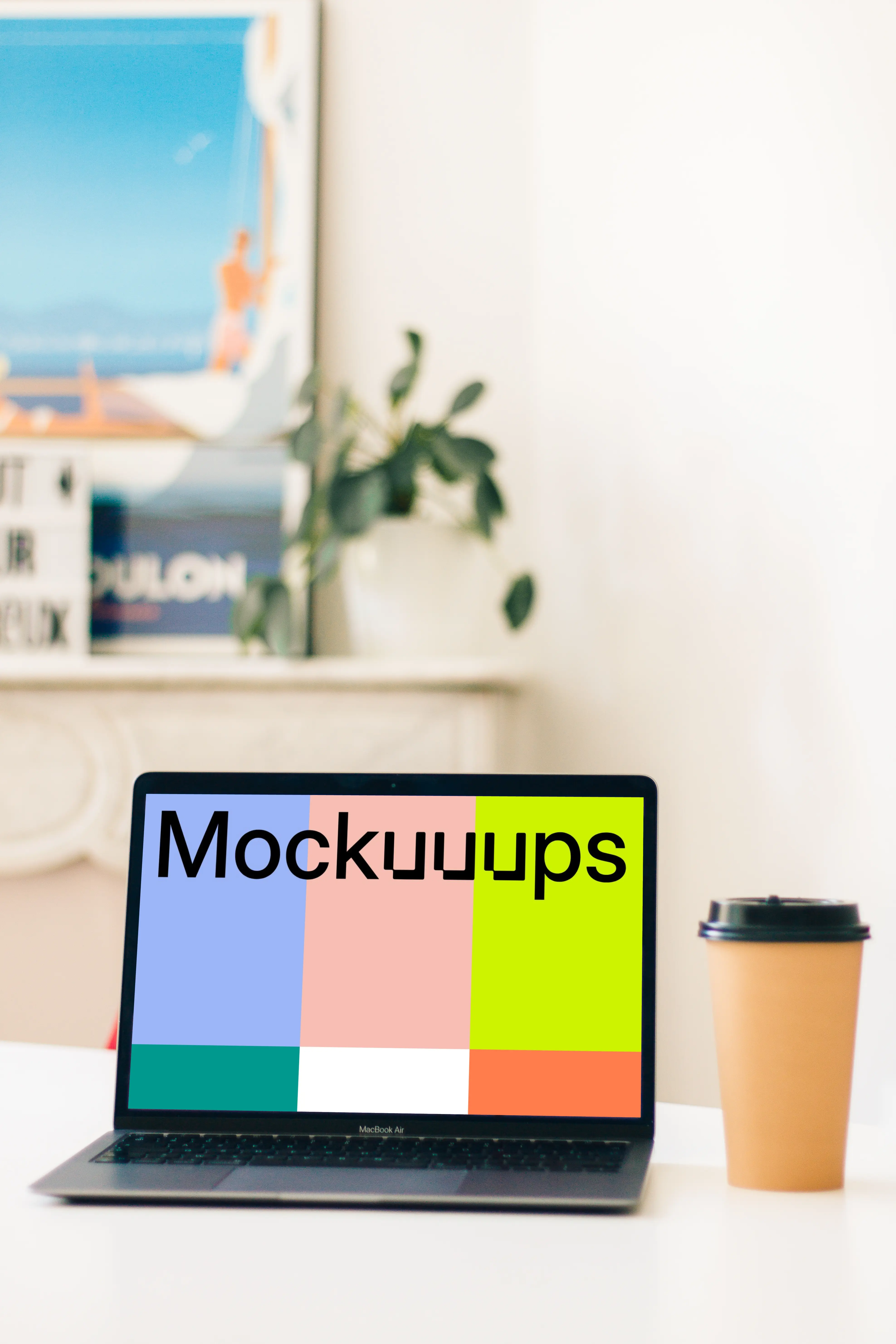 MacBook Air mockup beside a cup of coffee