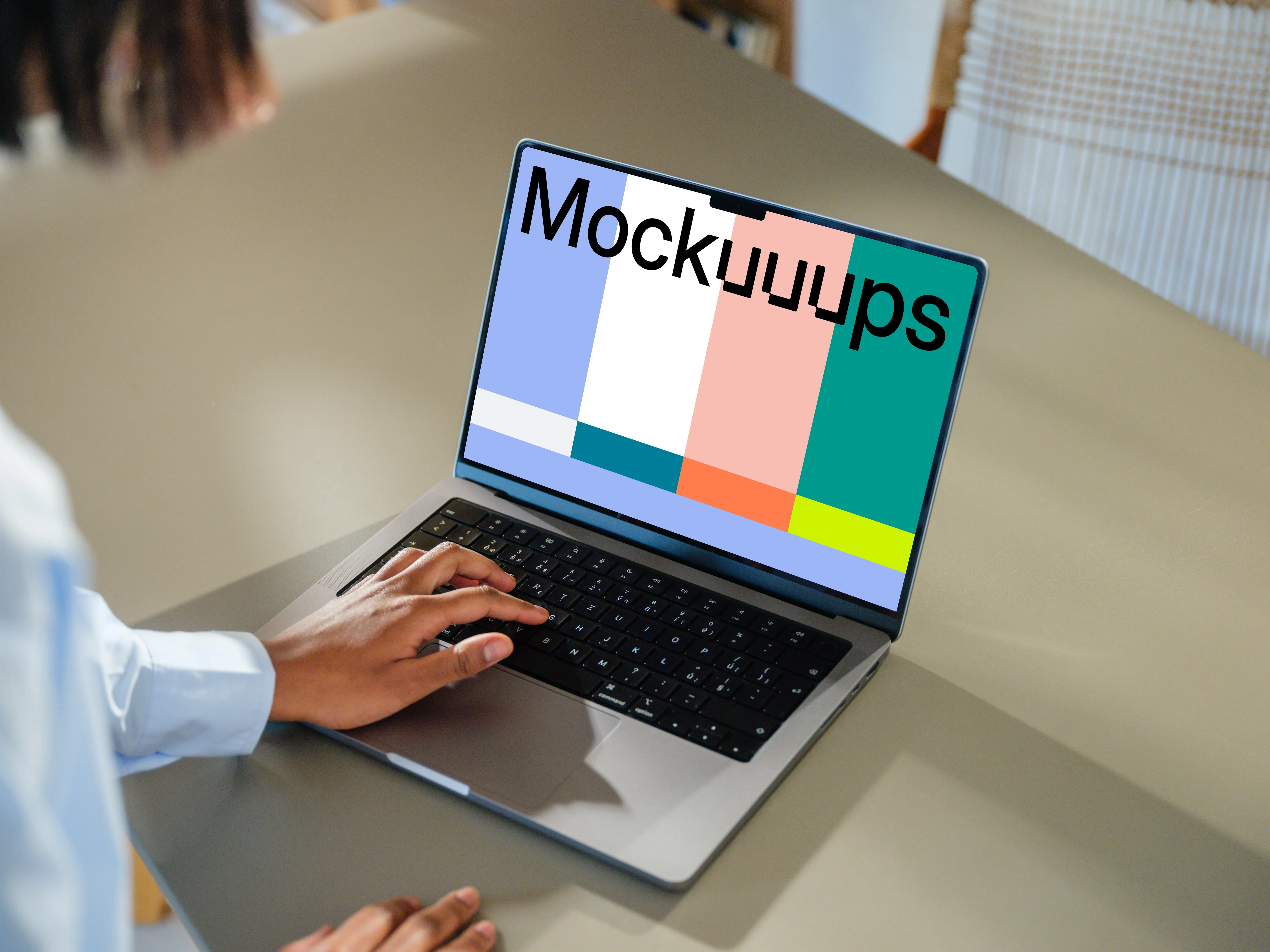 MacBook Pro 14-inch mockup at a modern desk