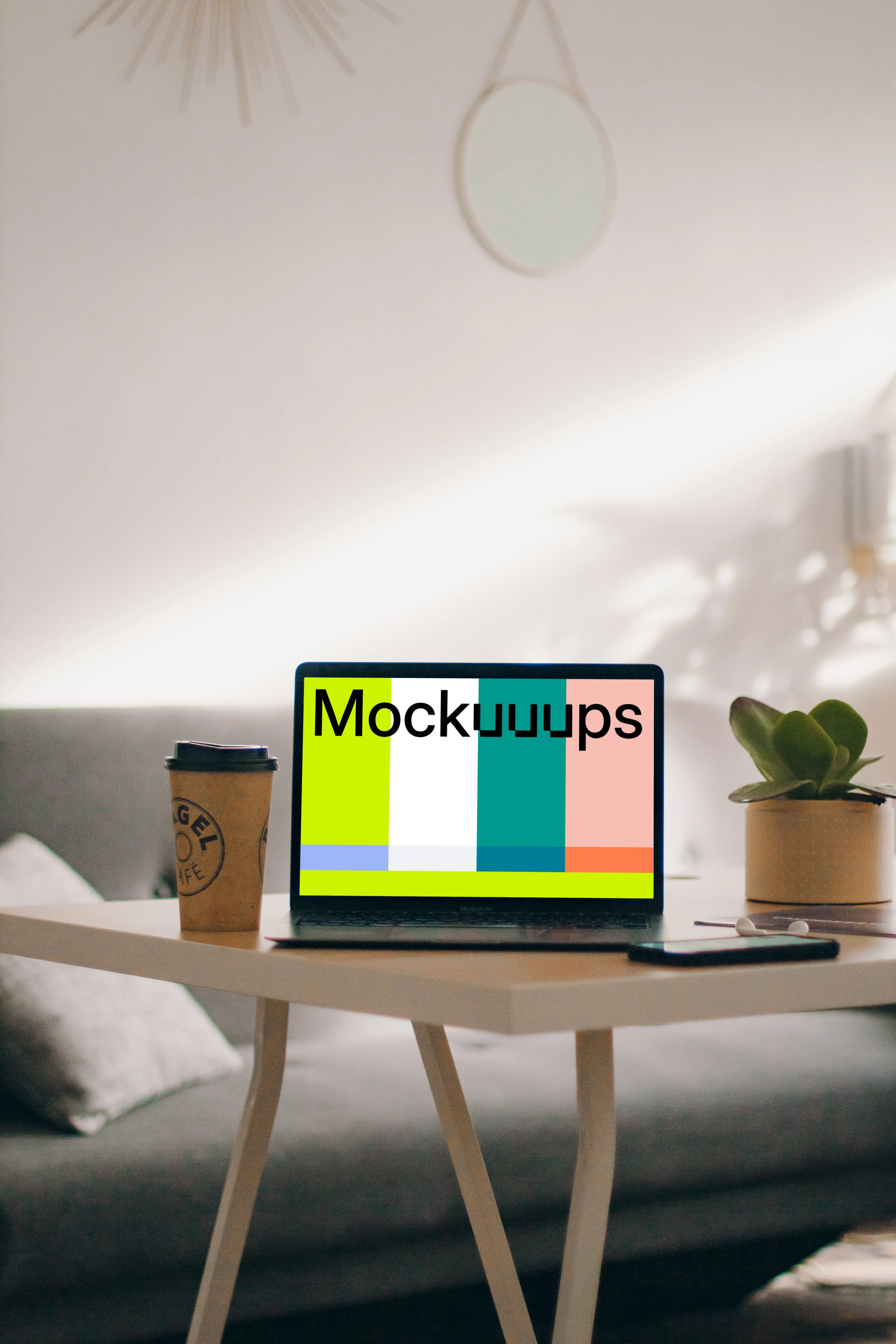 MacBook Pro mockup beside a cup of coffee