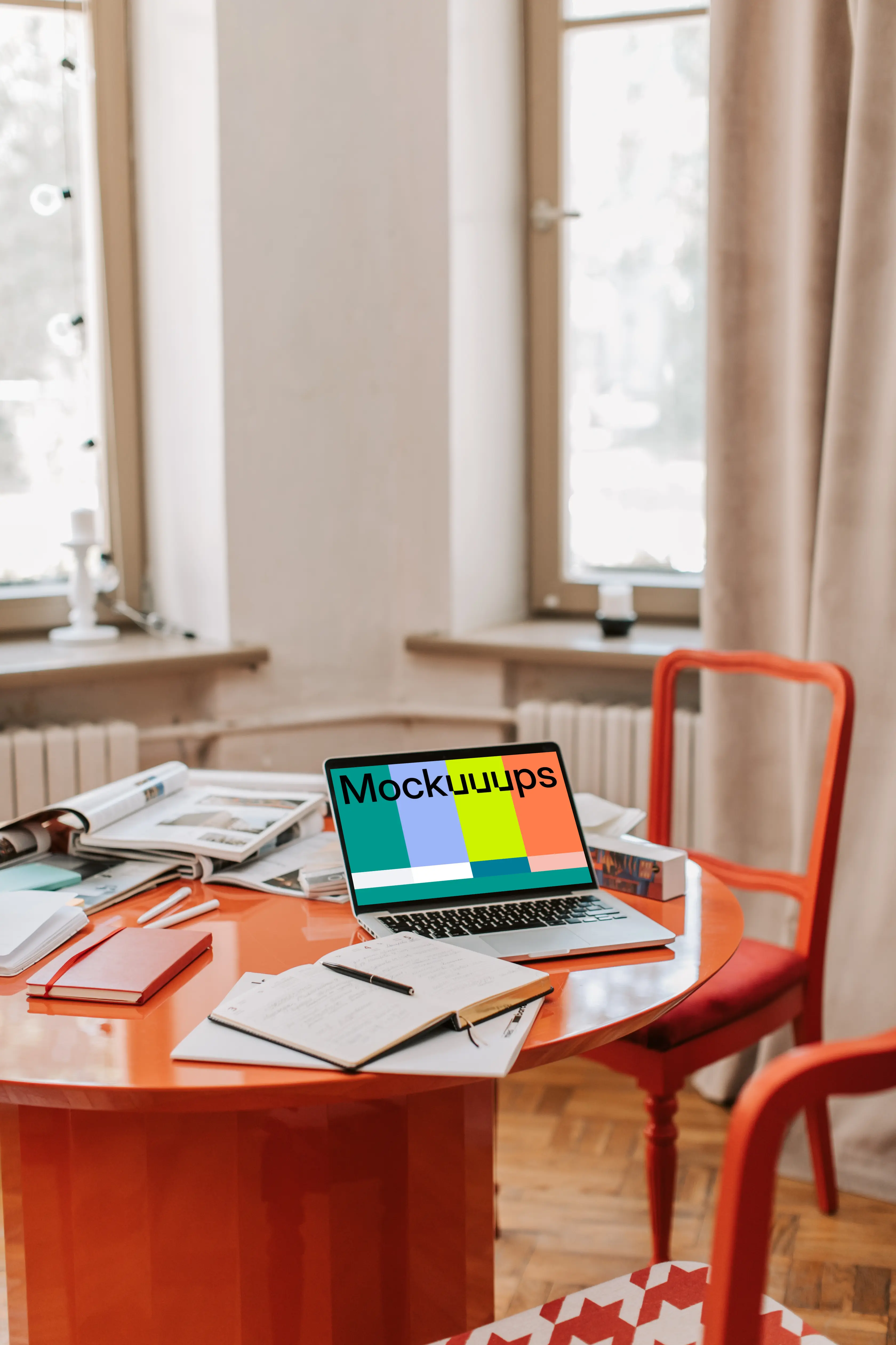 MacBook Pro mockup on a red table