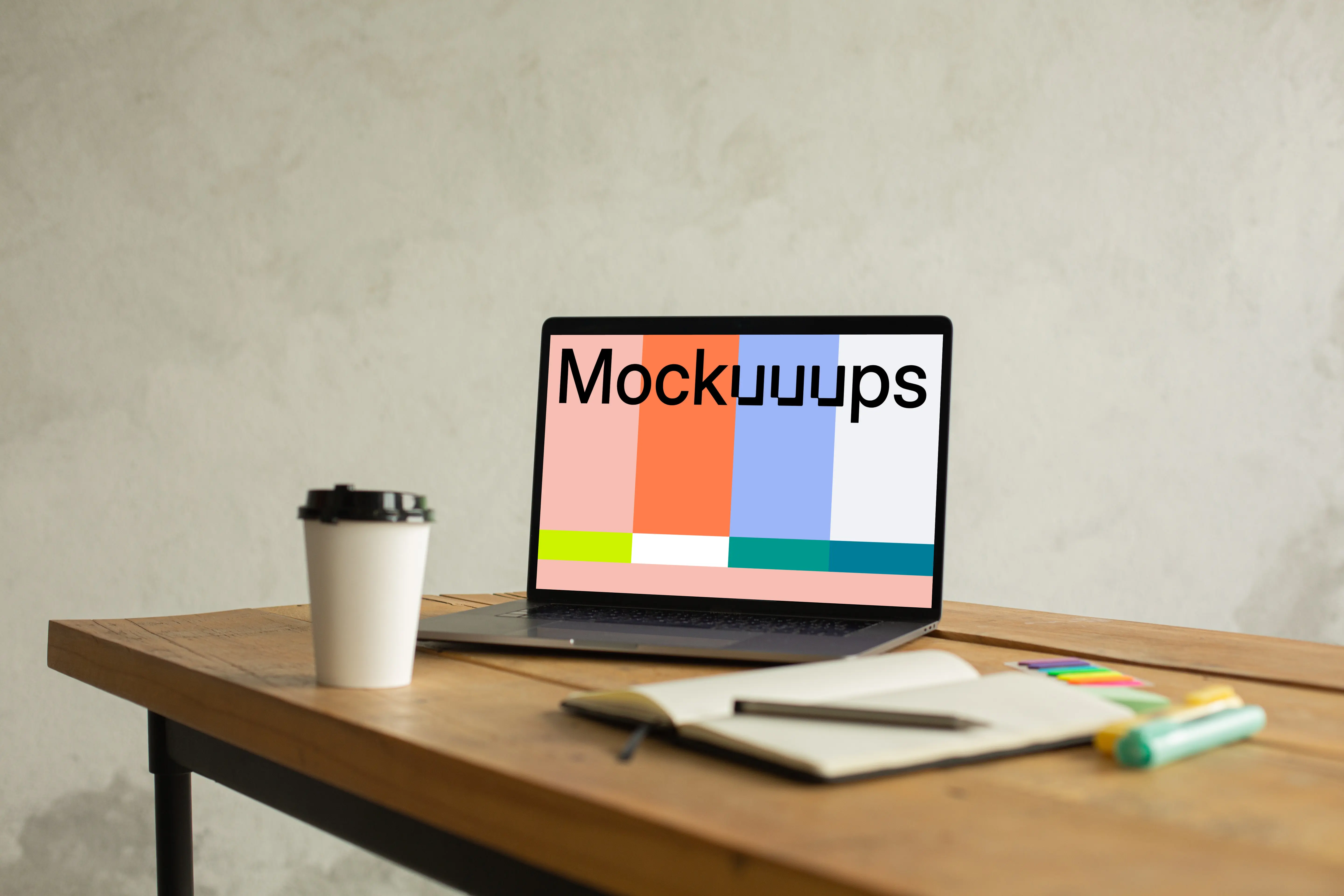 MacBook Pro mockup on a table beside a cup of coffee