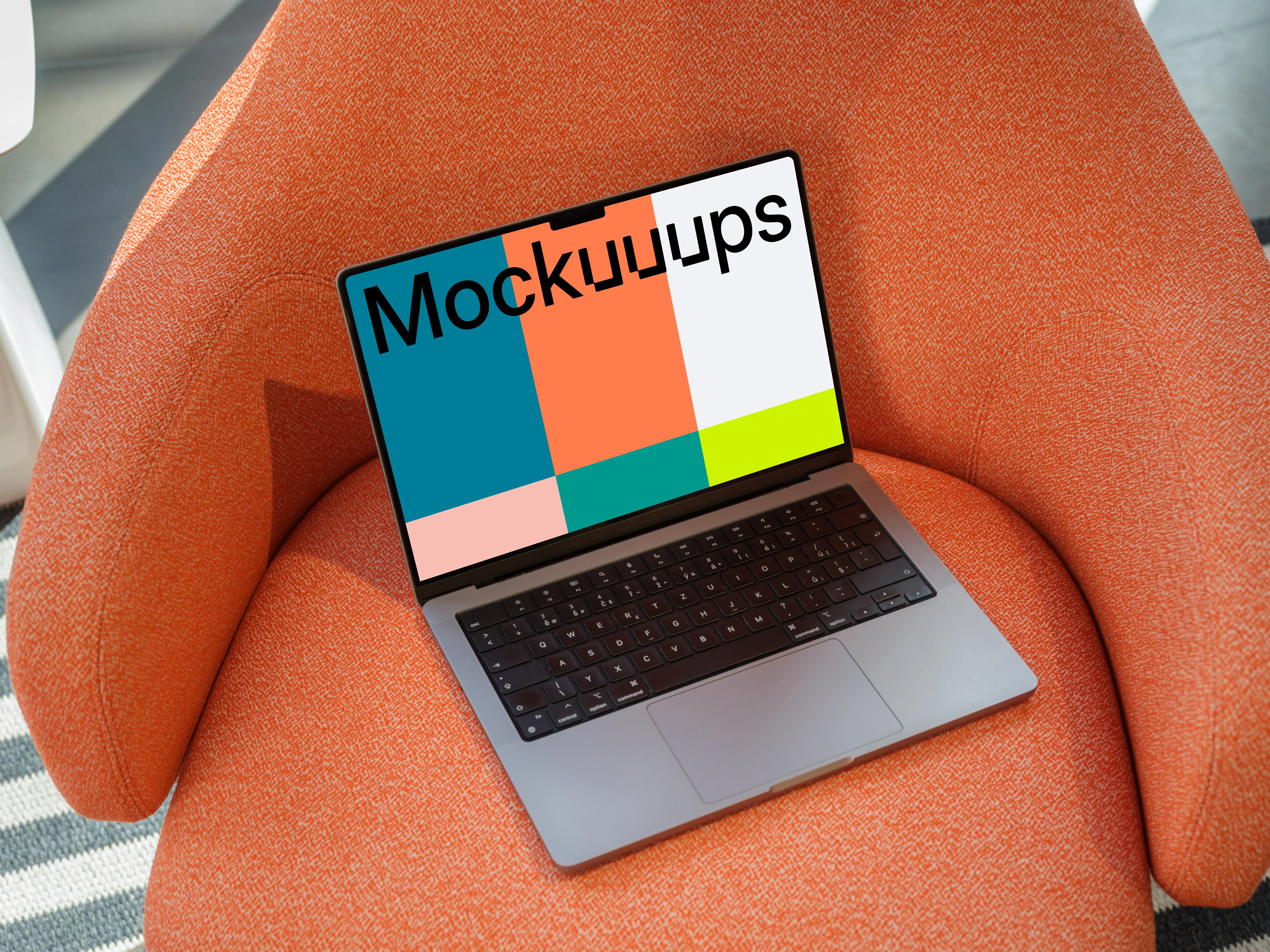 MacBook Pro Mockup on an Orange Textured Armchair