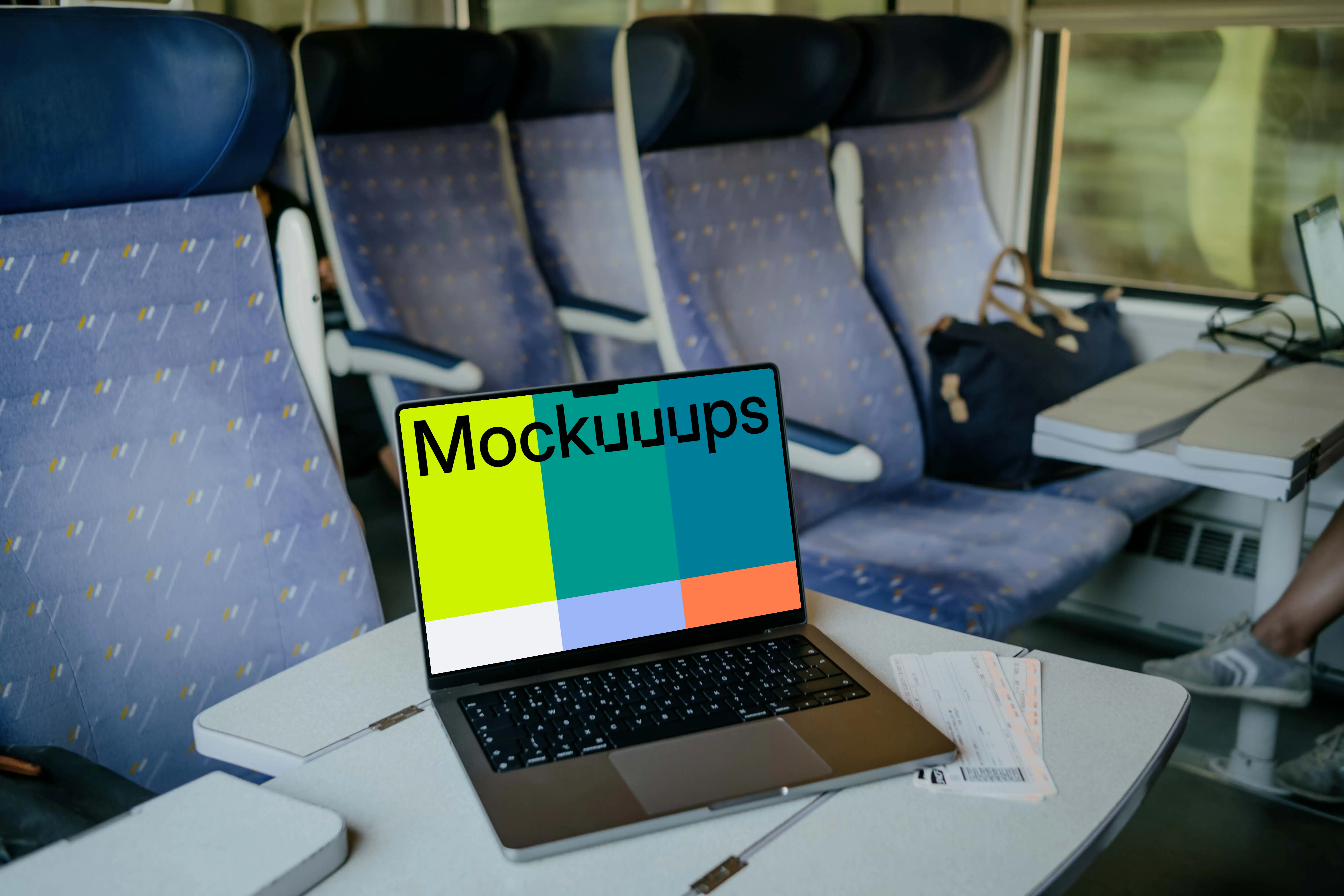 MacBook Pro mockup on train table