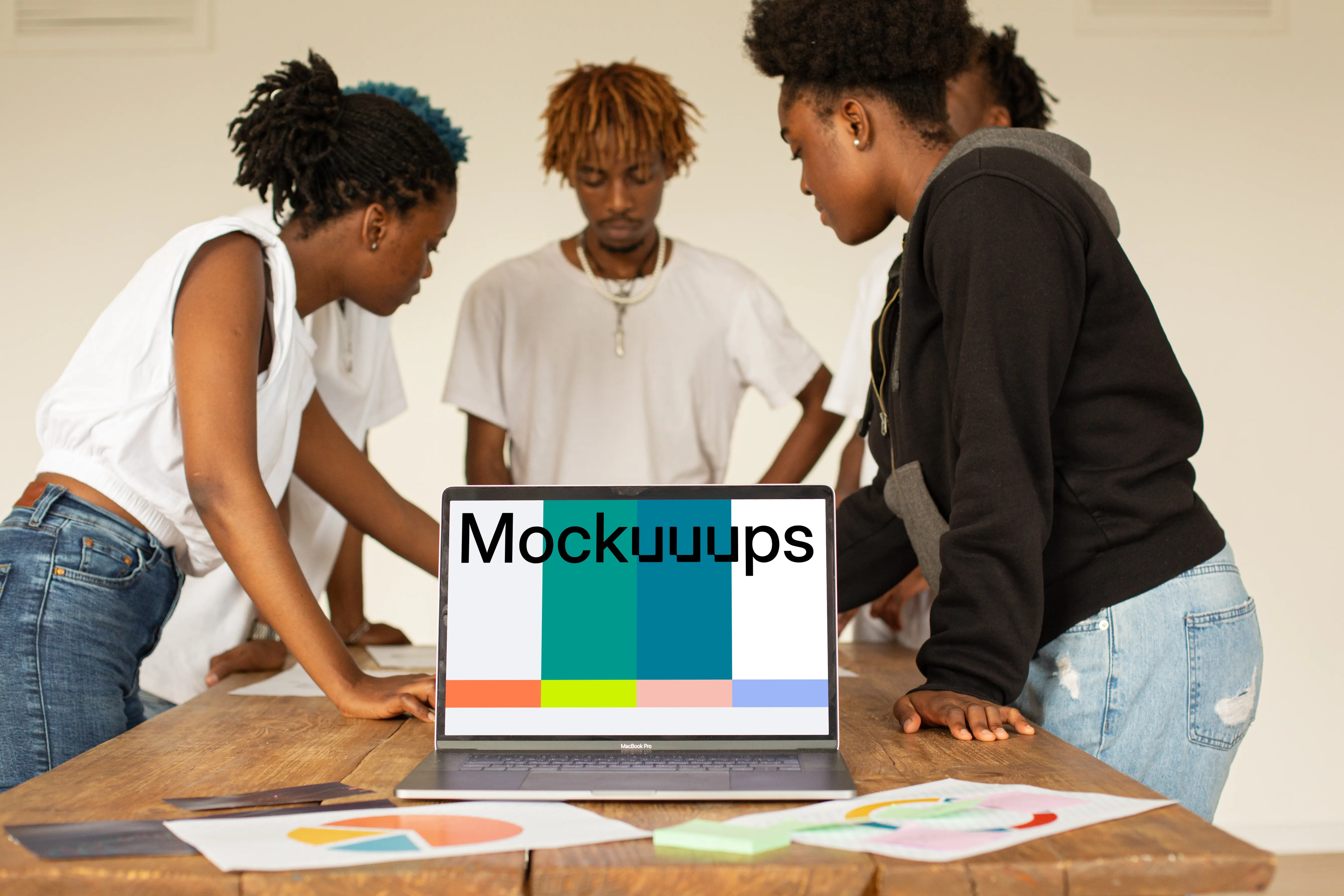 MacBook Pro mockup placed on a conference table