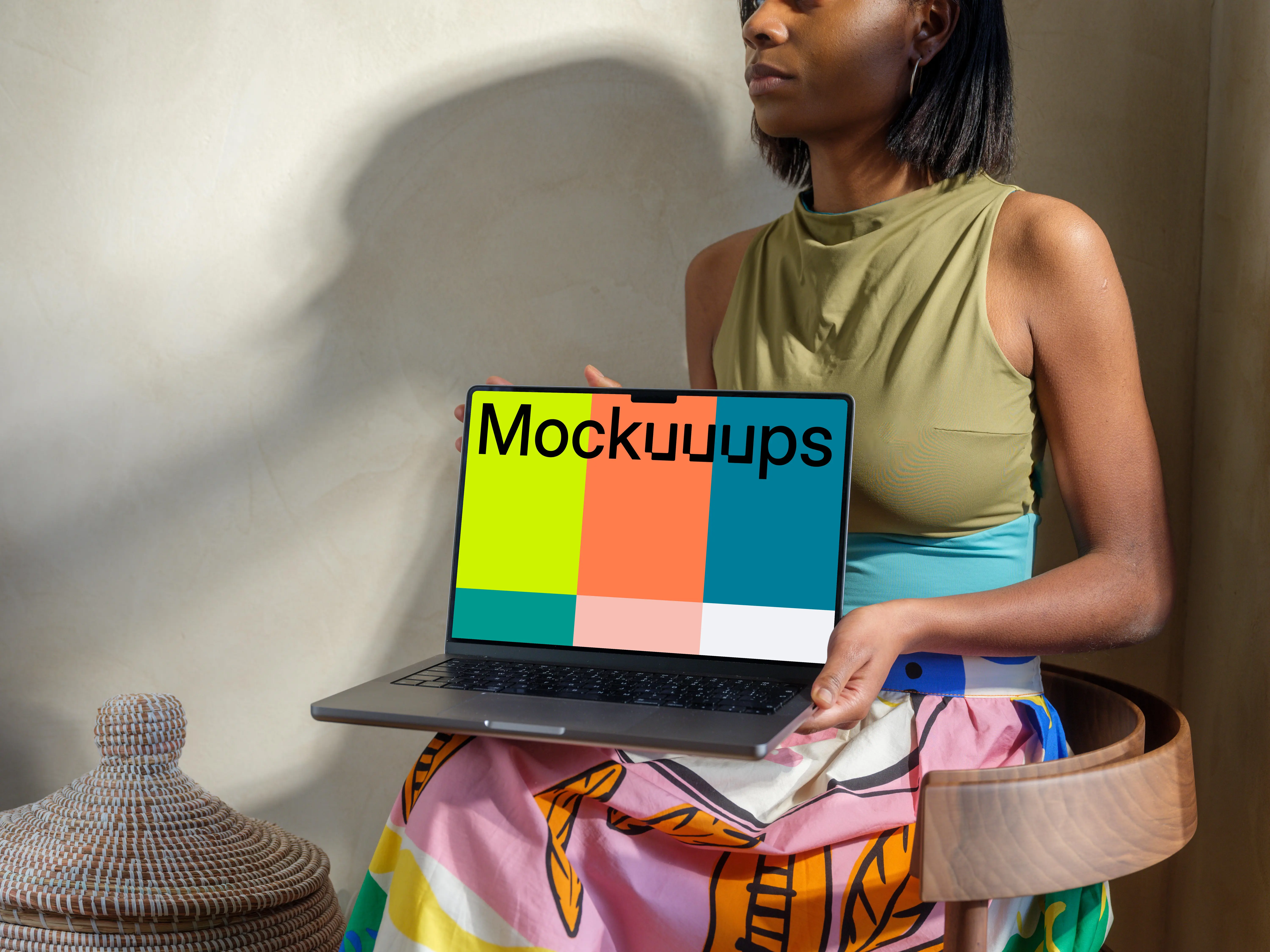 MacBook Pro mockup with female hand in a home setting