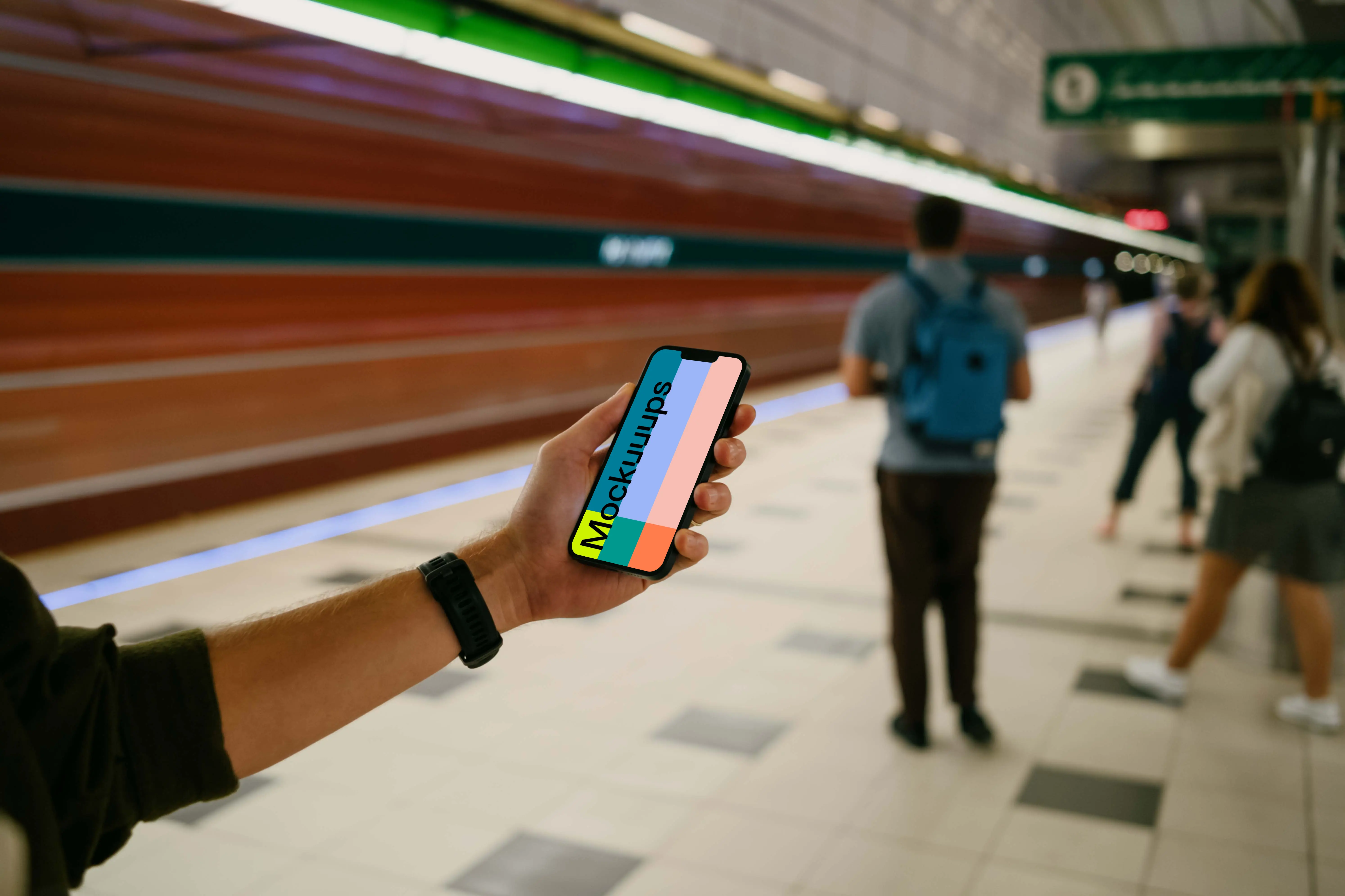 Male hand holding an iPhone 13 mockup