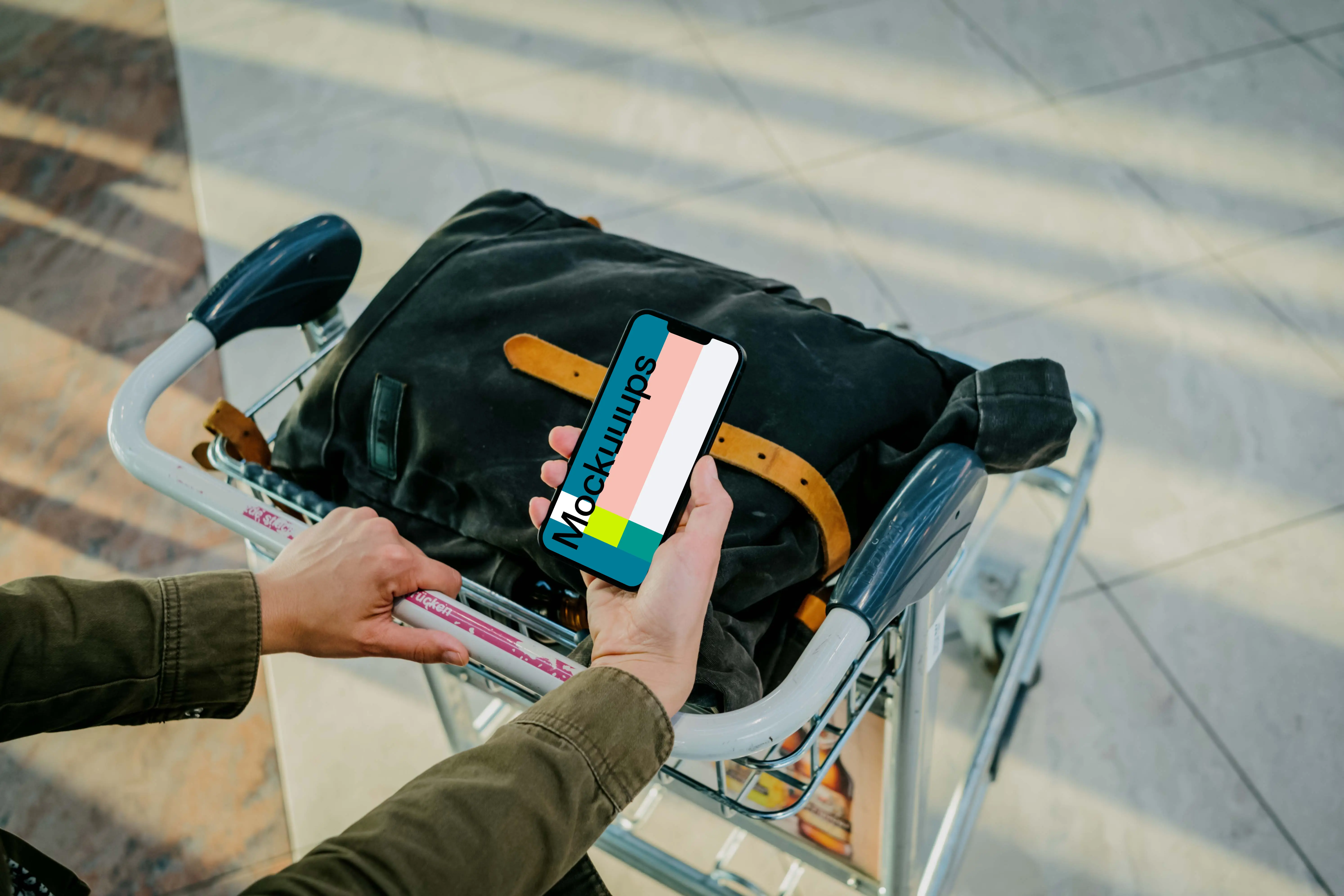 Man hand holding an iPhone 13 mockup