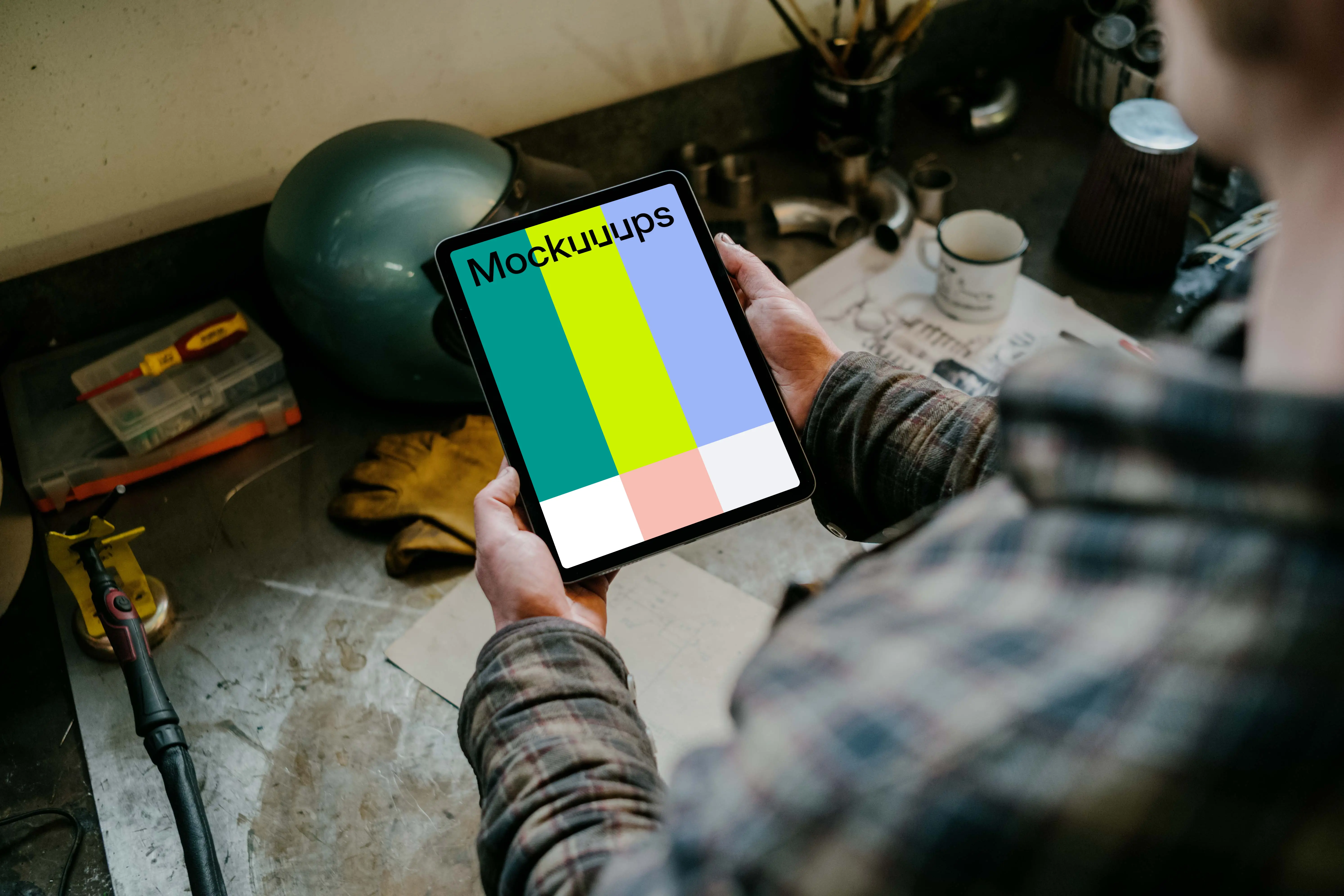 Man holding up an iPad Air mockup
