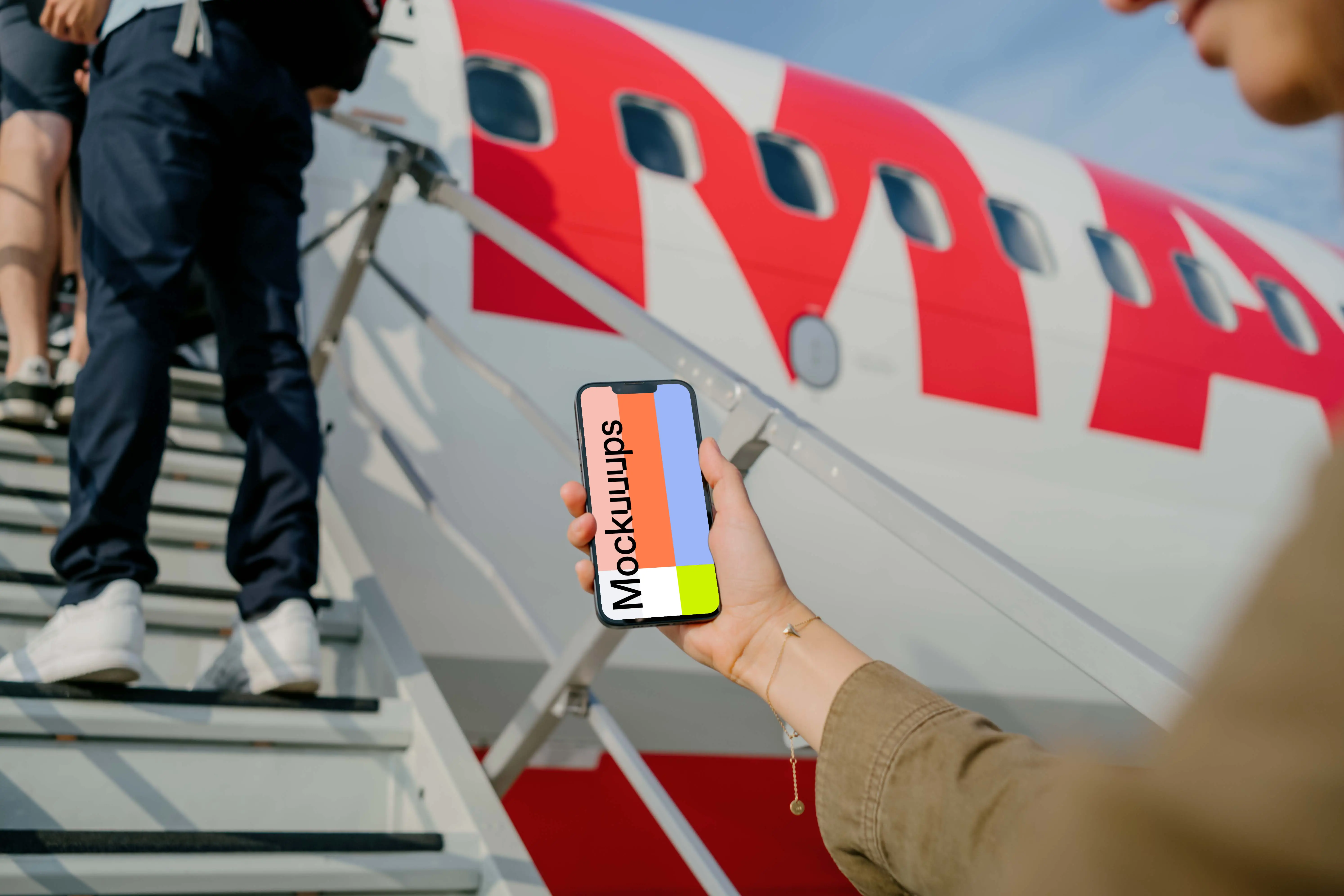 Man looking at an iPhone 13 mockup