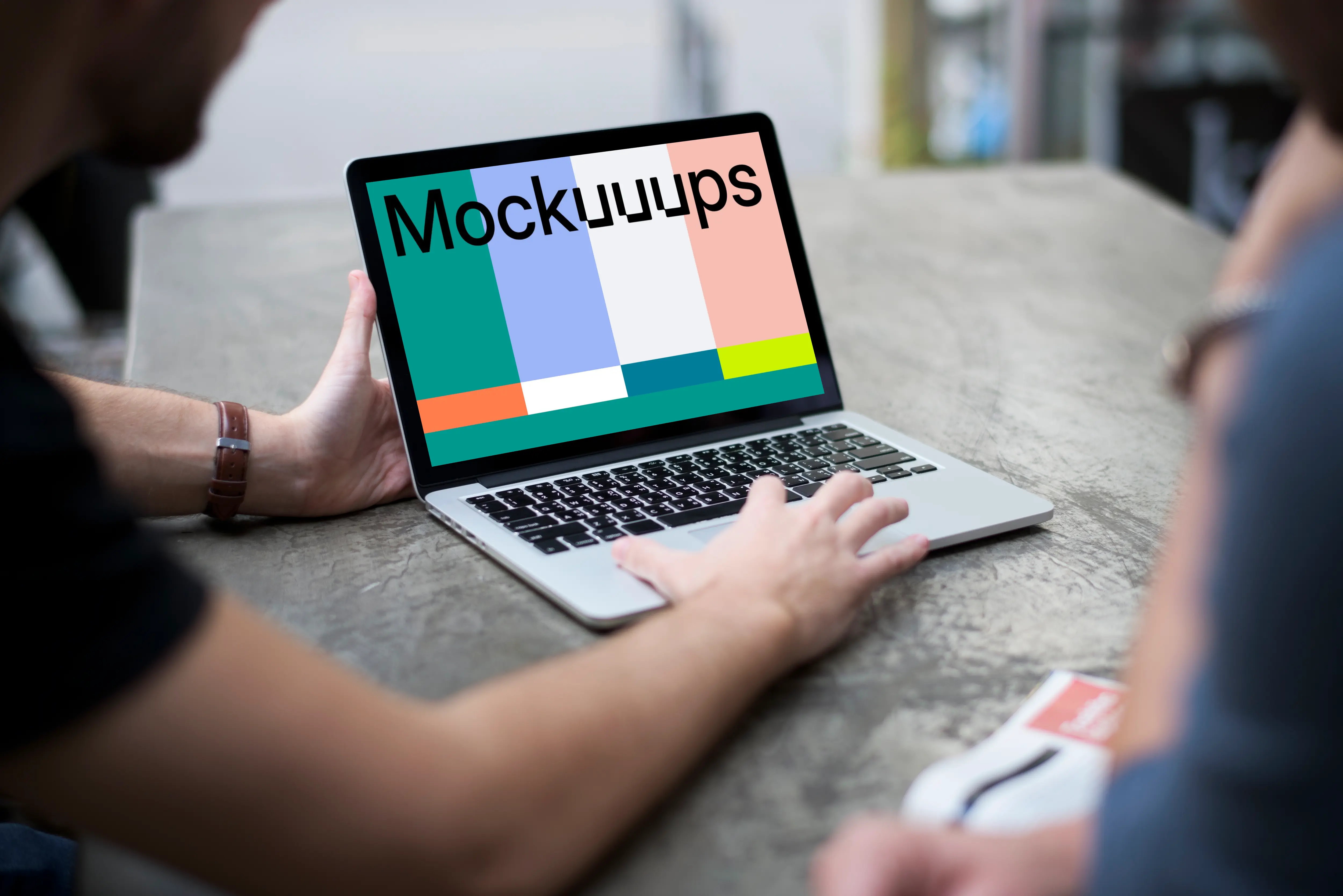 Man working on a MacBook Pro mockup