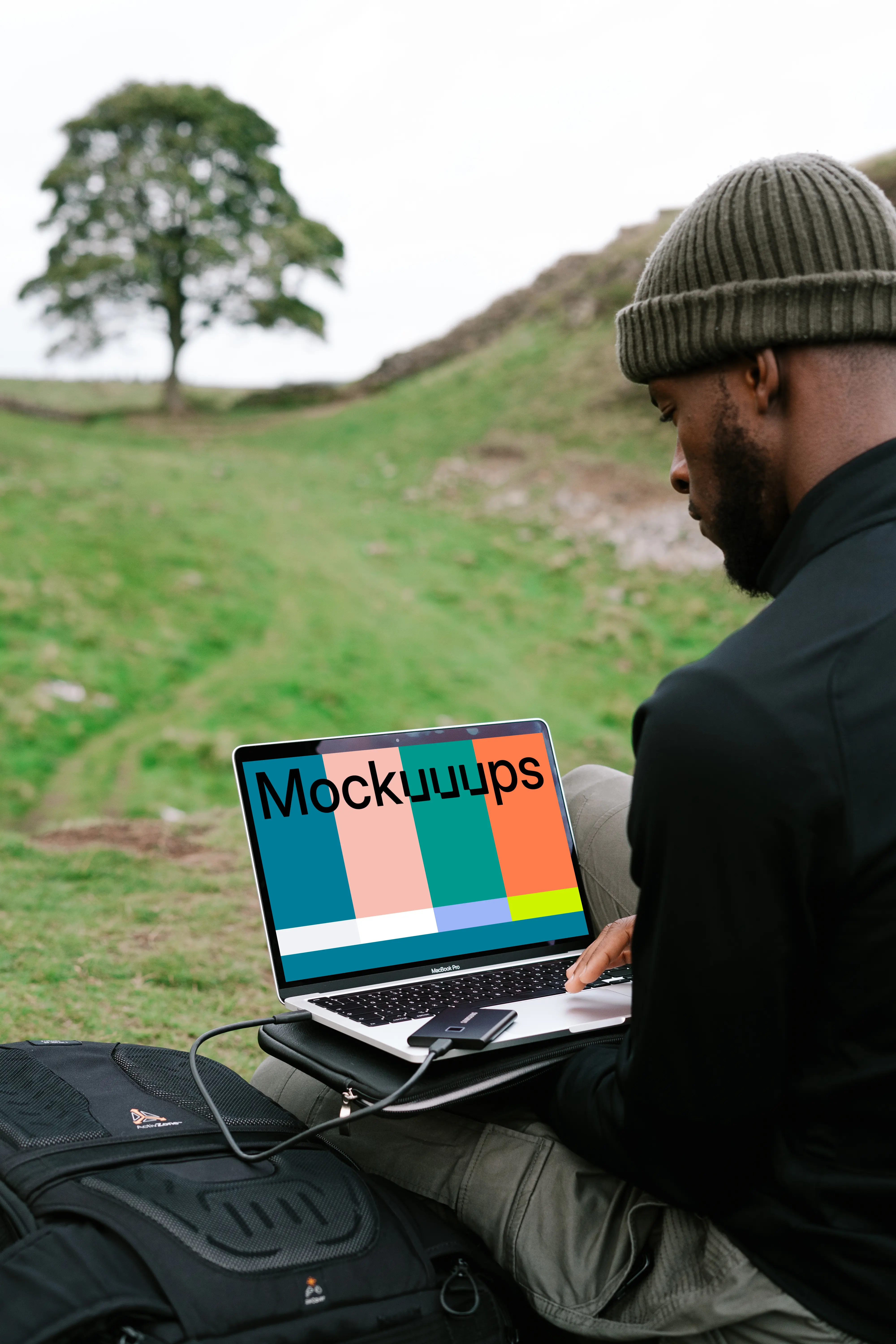Man working on MacBook Pro mockup