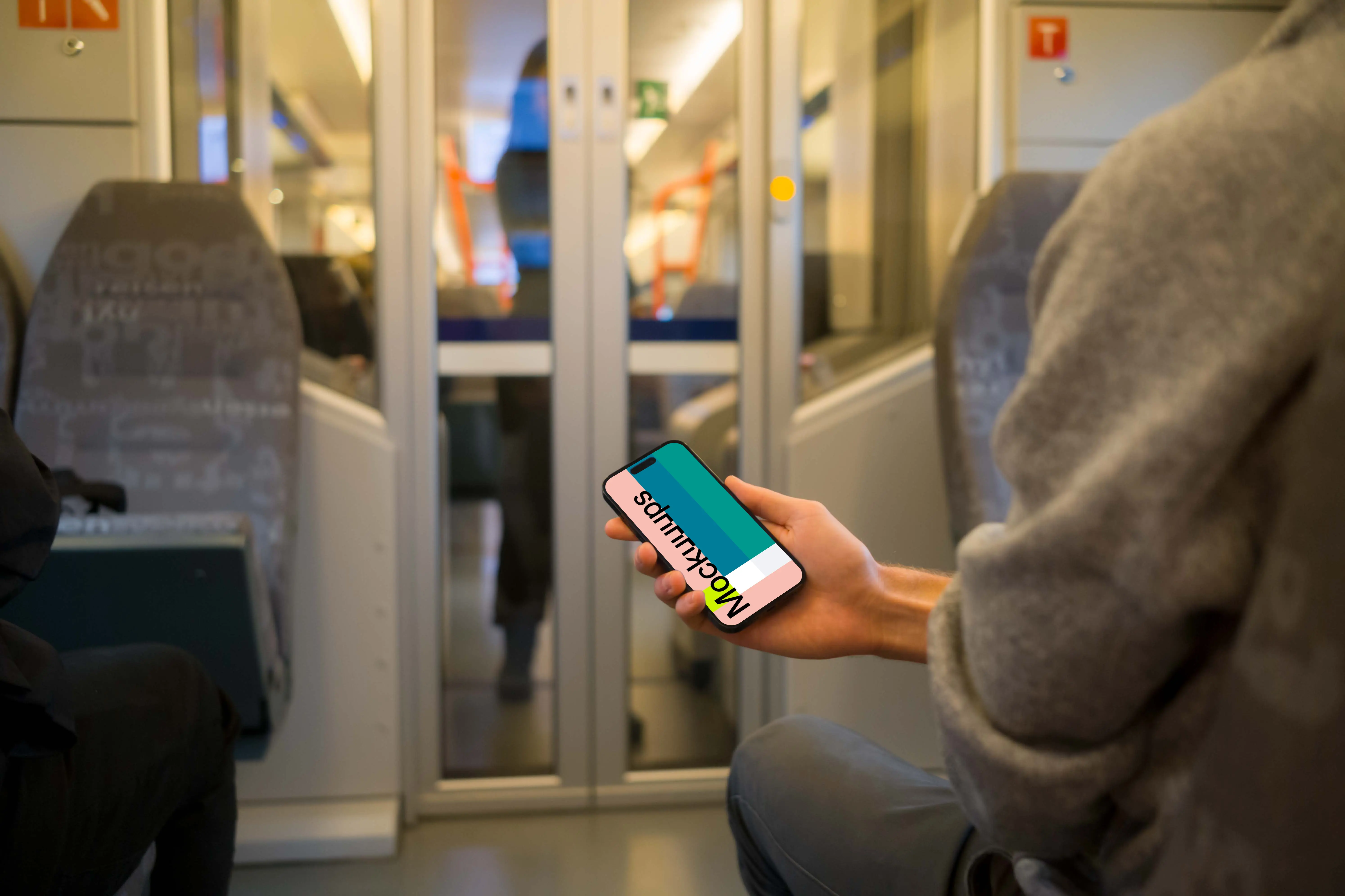 Passenger holding smartphone on the train mockup