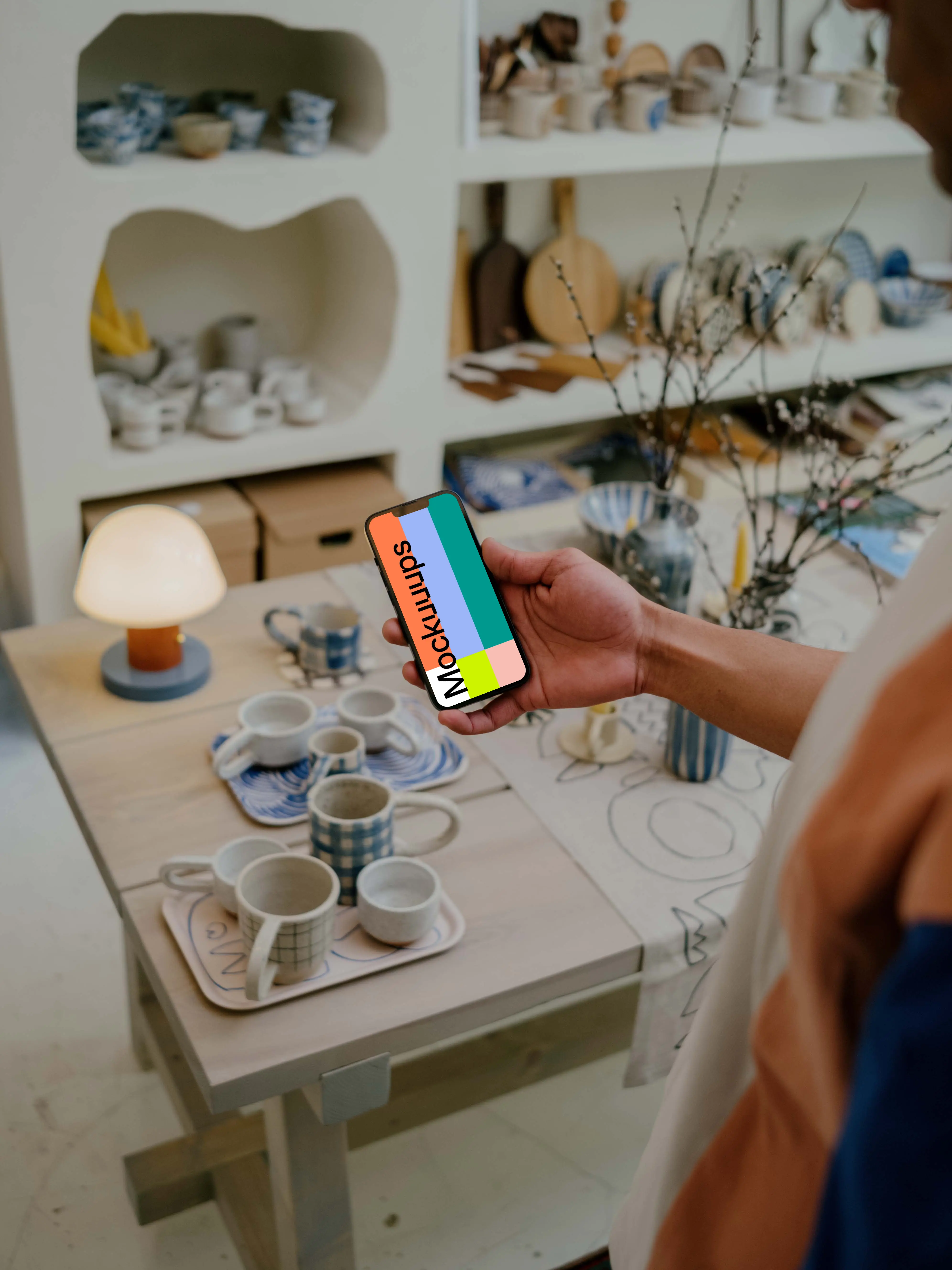 Person reading on iPhone 13 mockup