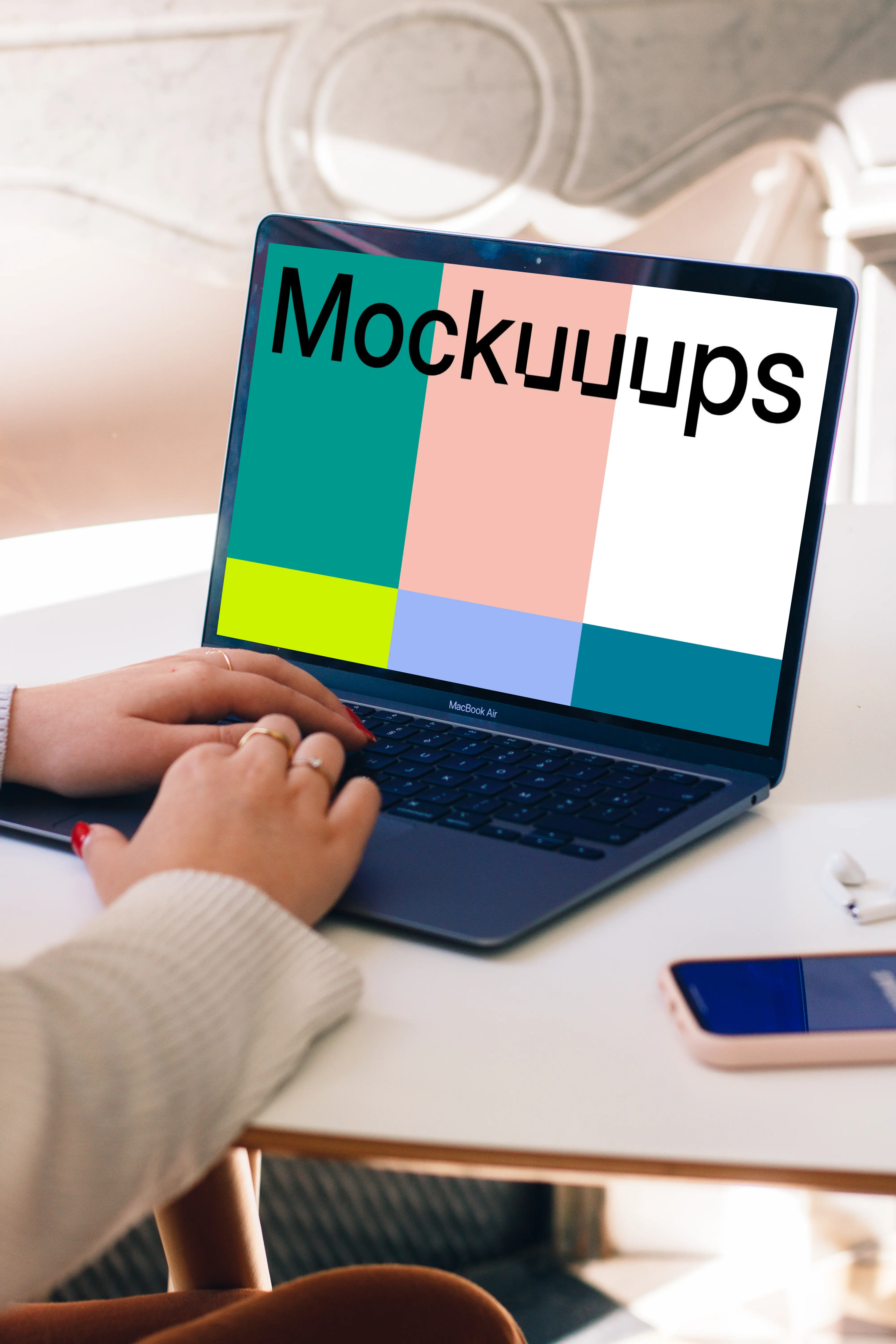 Person typing on a MacBook Air mockup