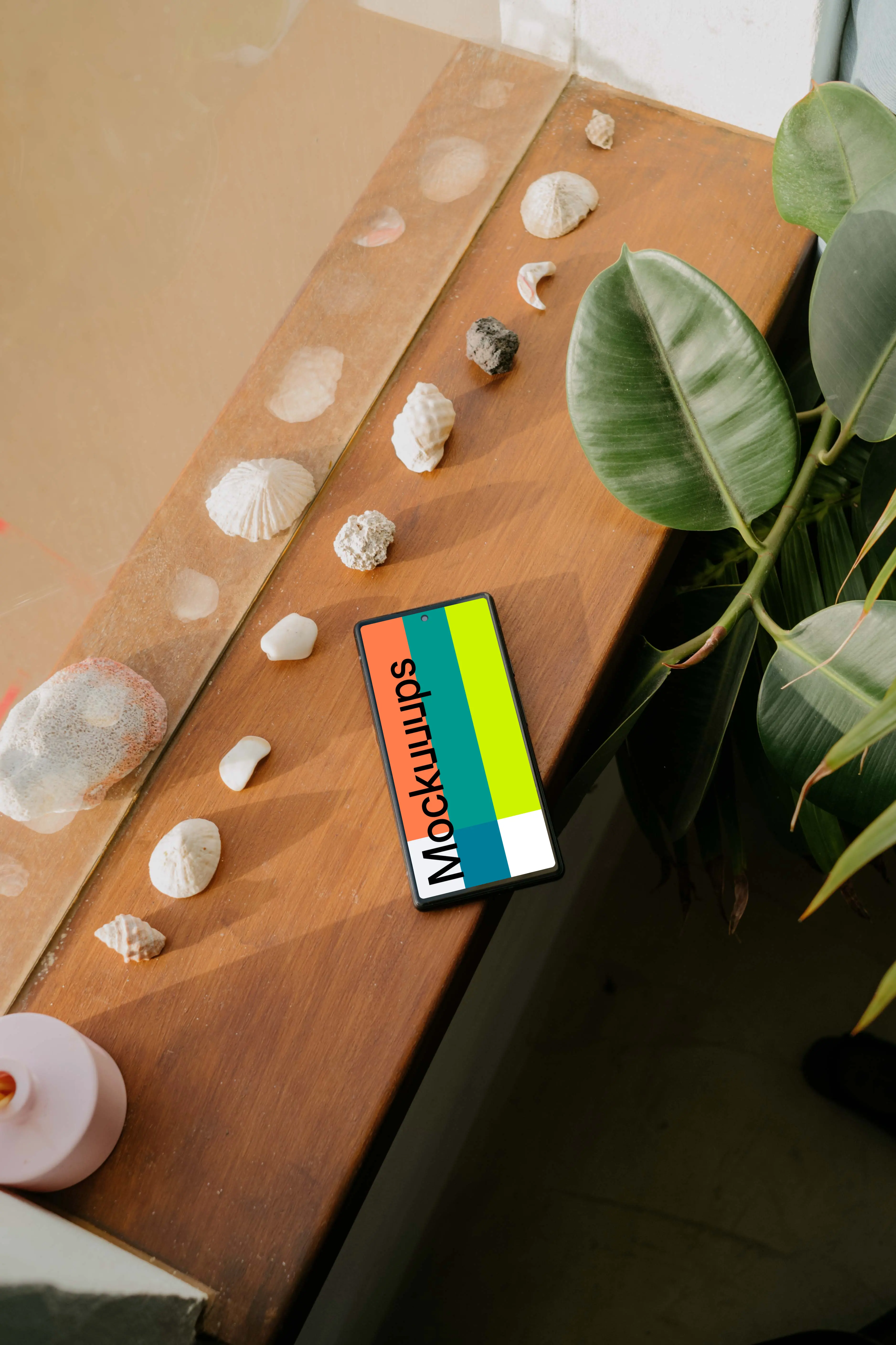 Pixel 6 mockup beside some seashells