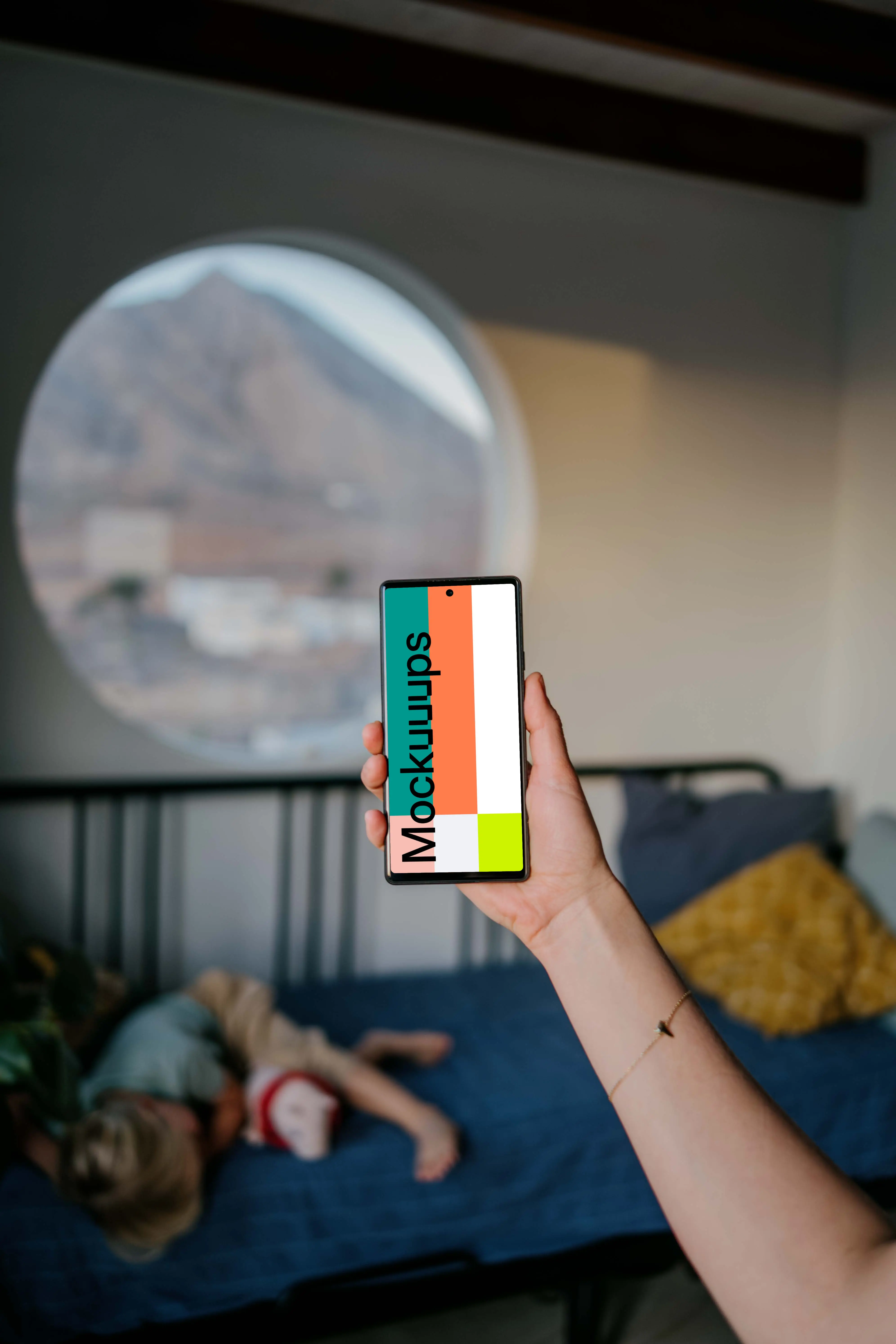 Pixel 6 mockup held by user in a bedroom