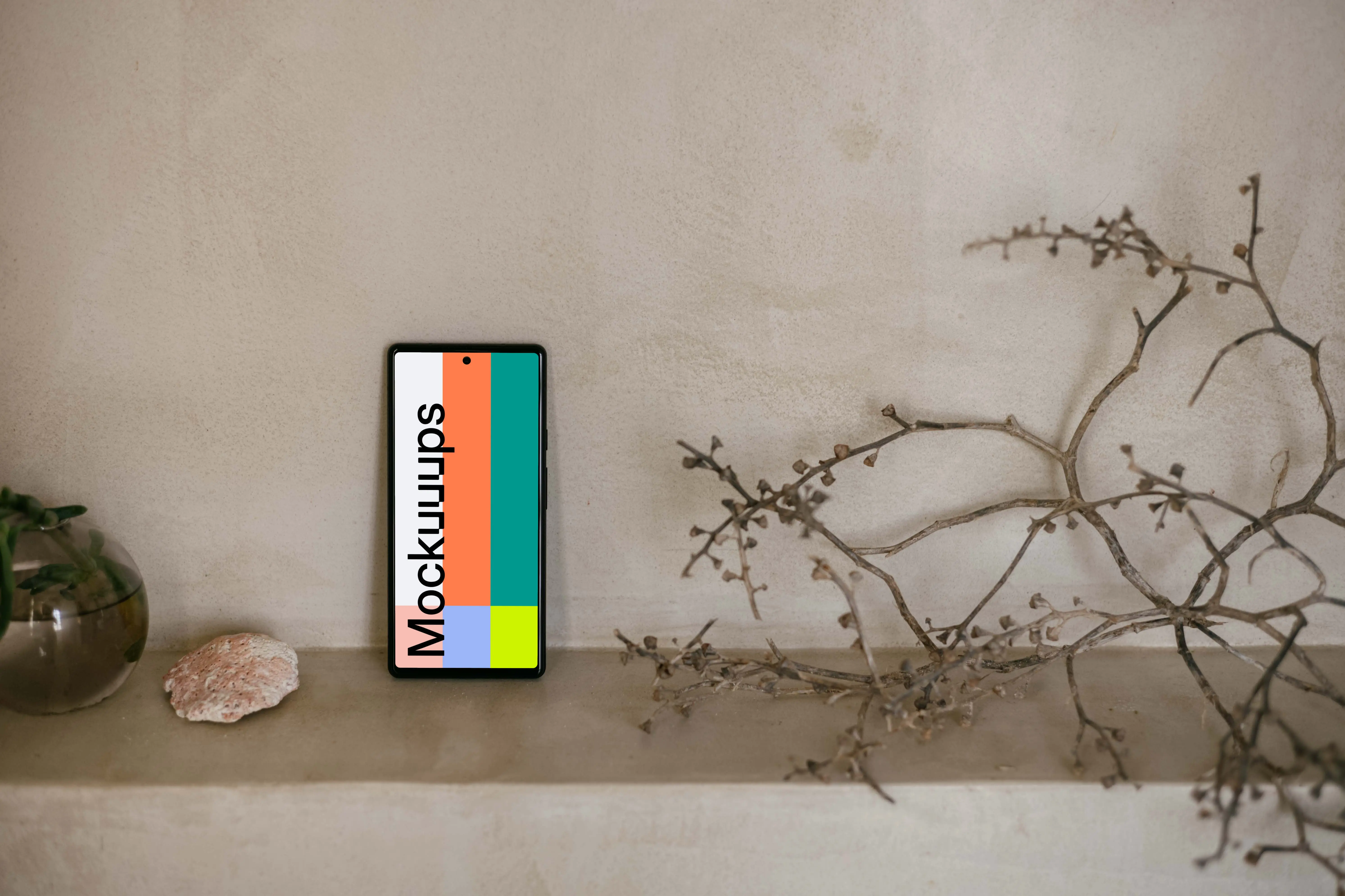 Pixel 6 mockup next to a teapot and plant