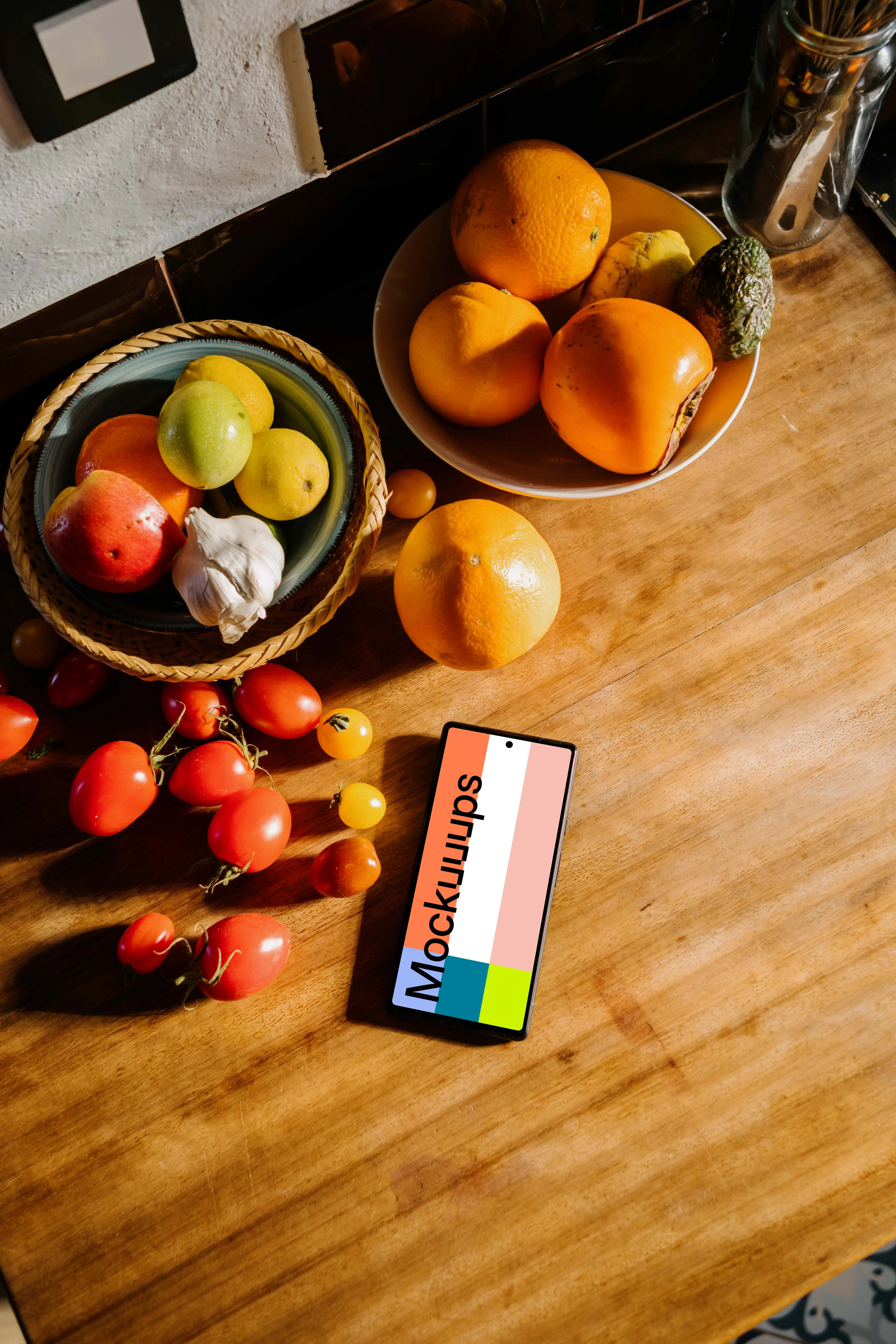 Pixel 6 mockup on a table next to fruits