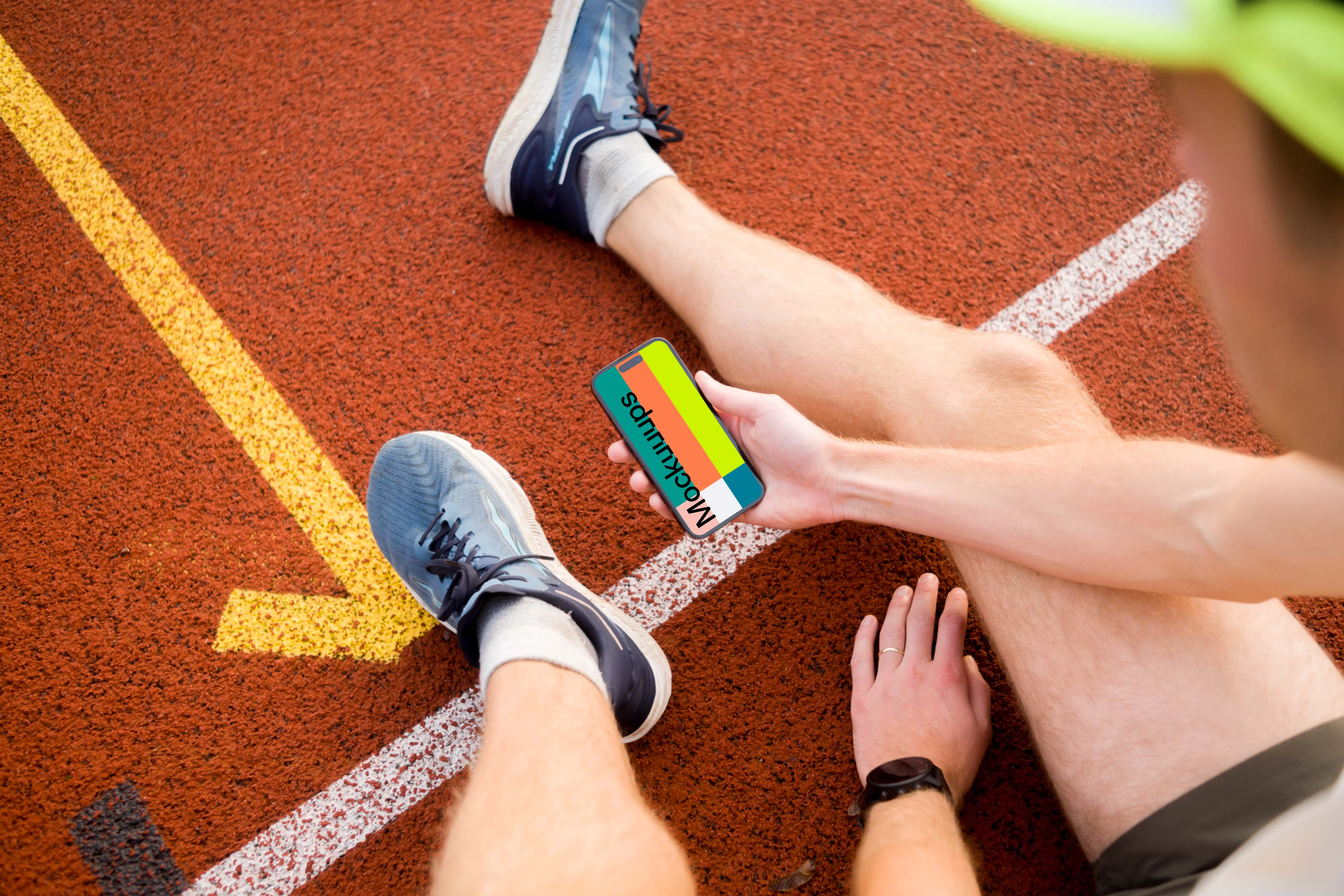 Runner holding a smartphone mockup