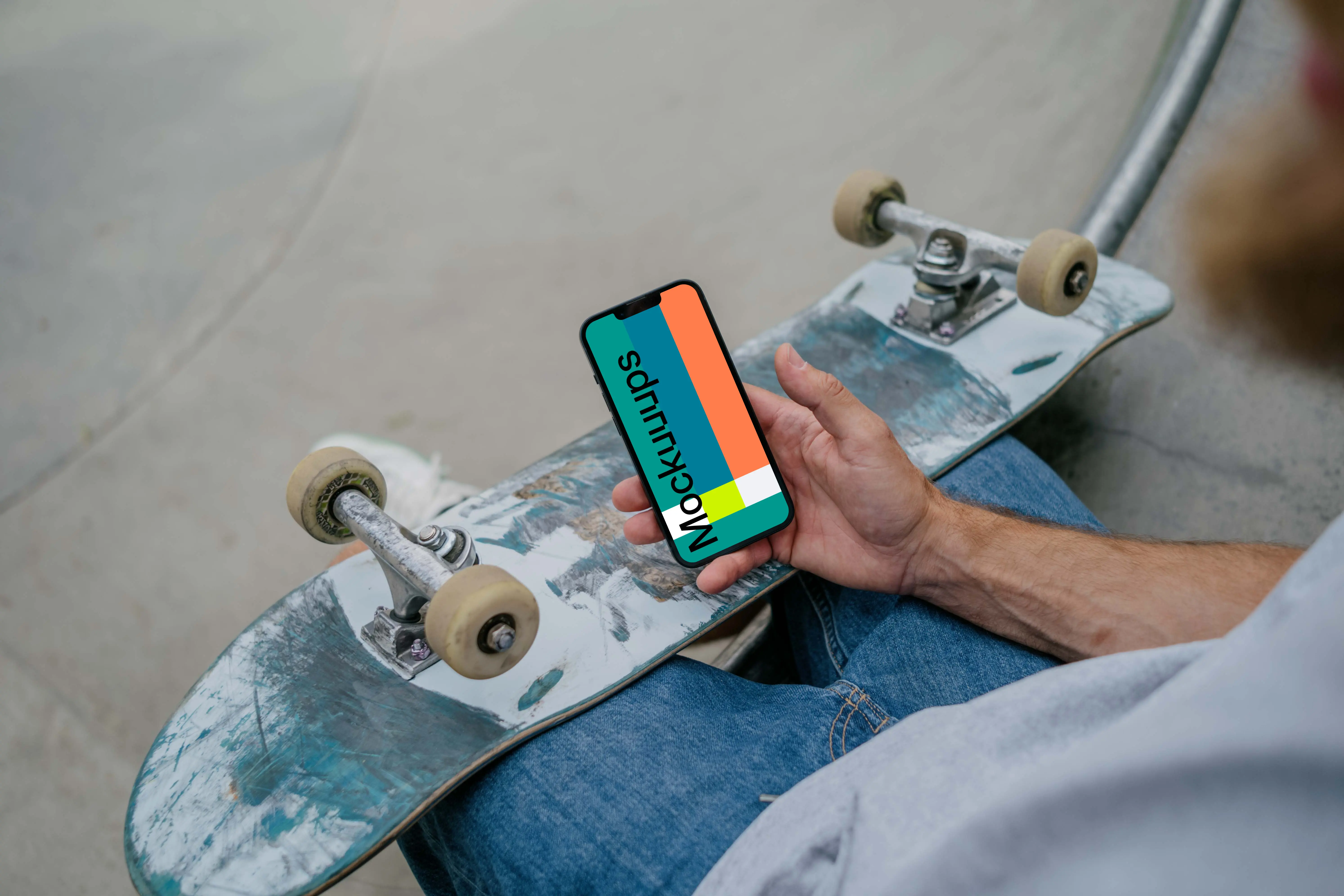 Skateboarder holding a smartphone mockup