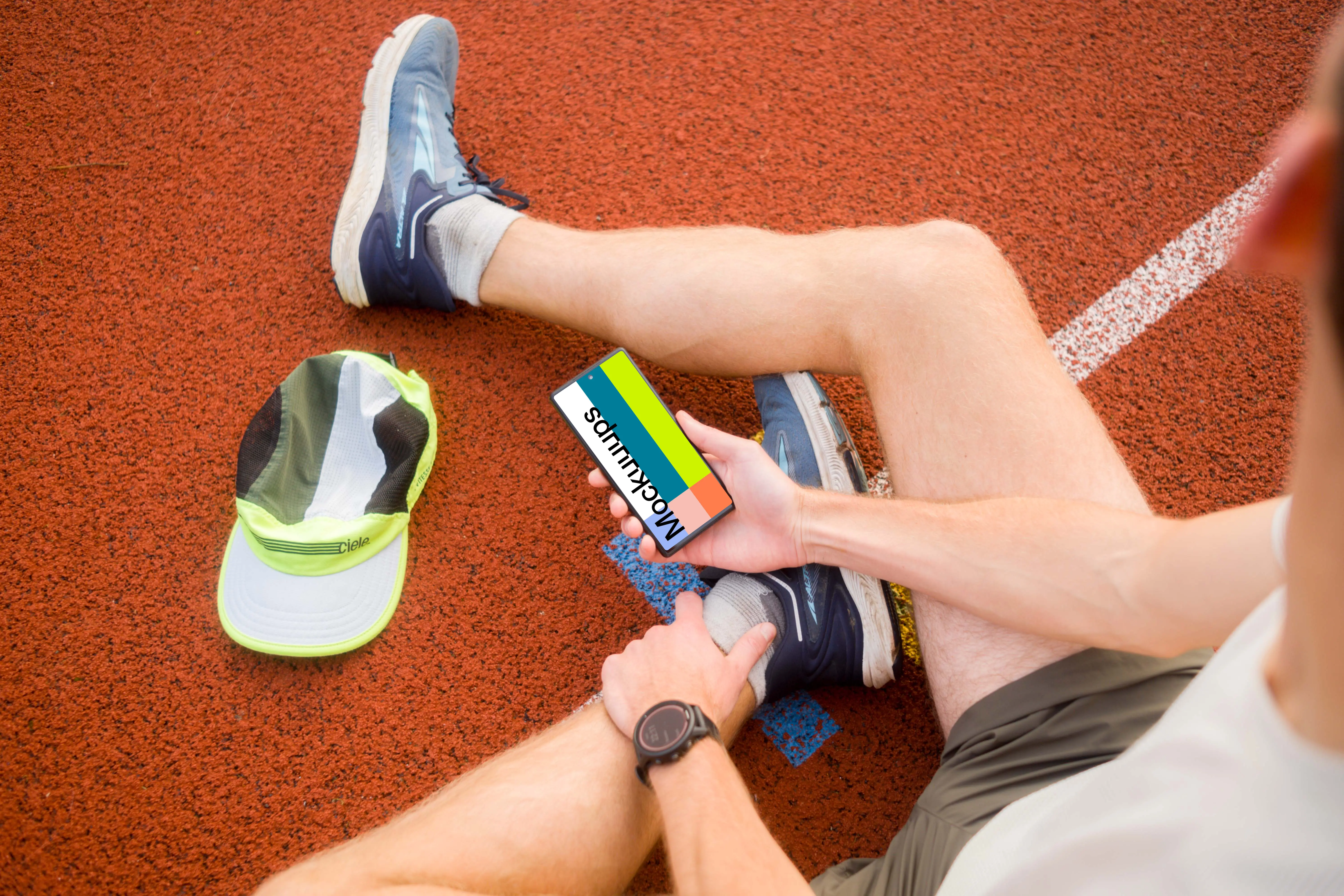 Sport mockup with athlete holding a phone