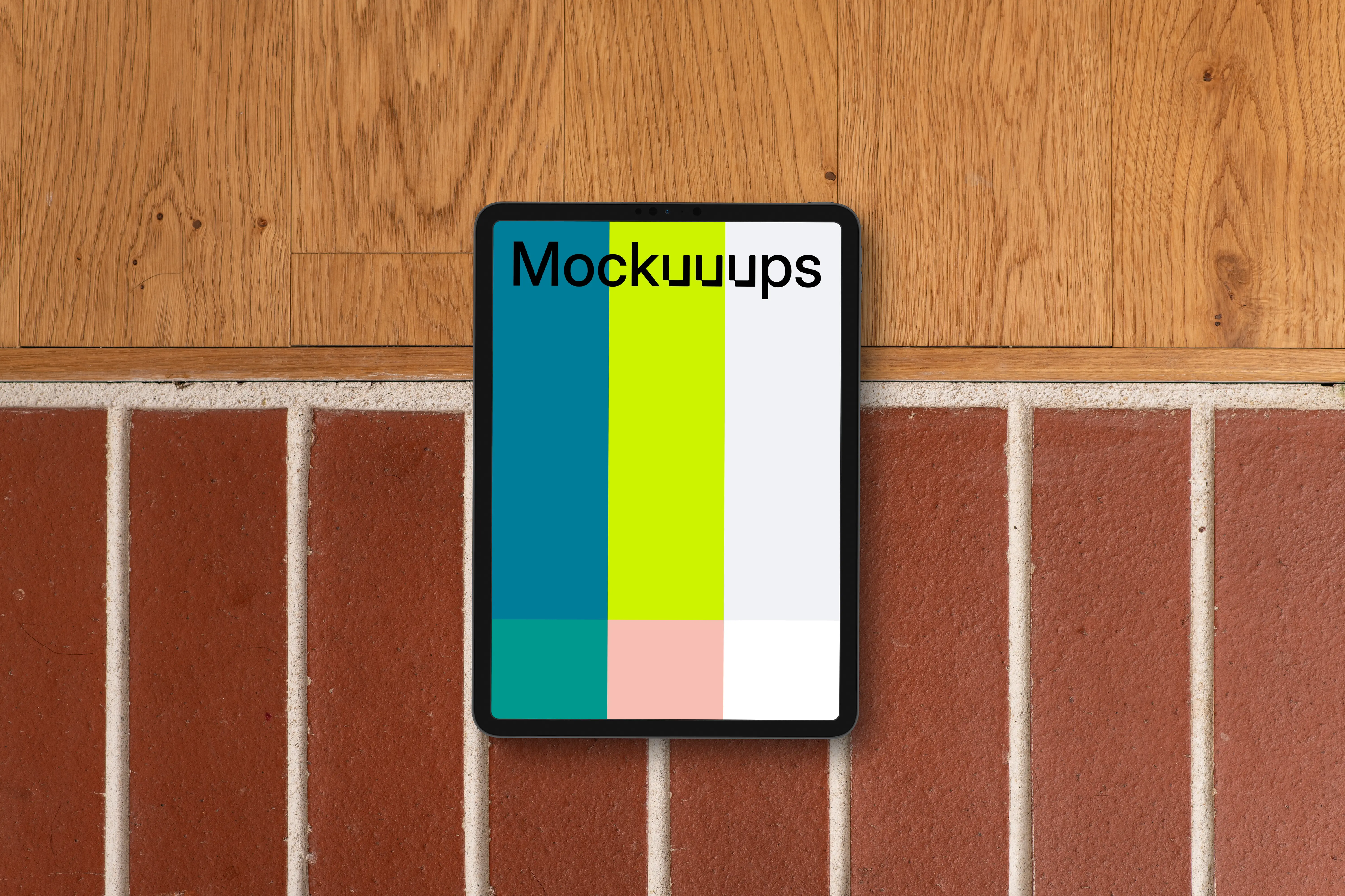 Tablet mockup against brick and wood backdrop