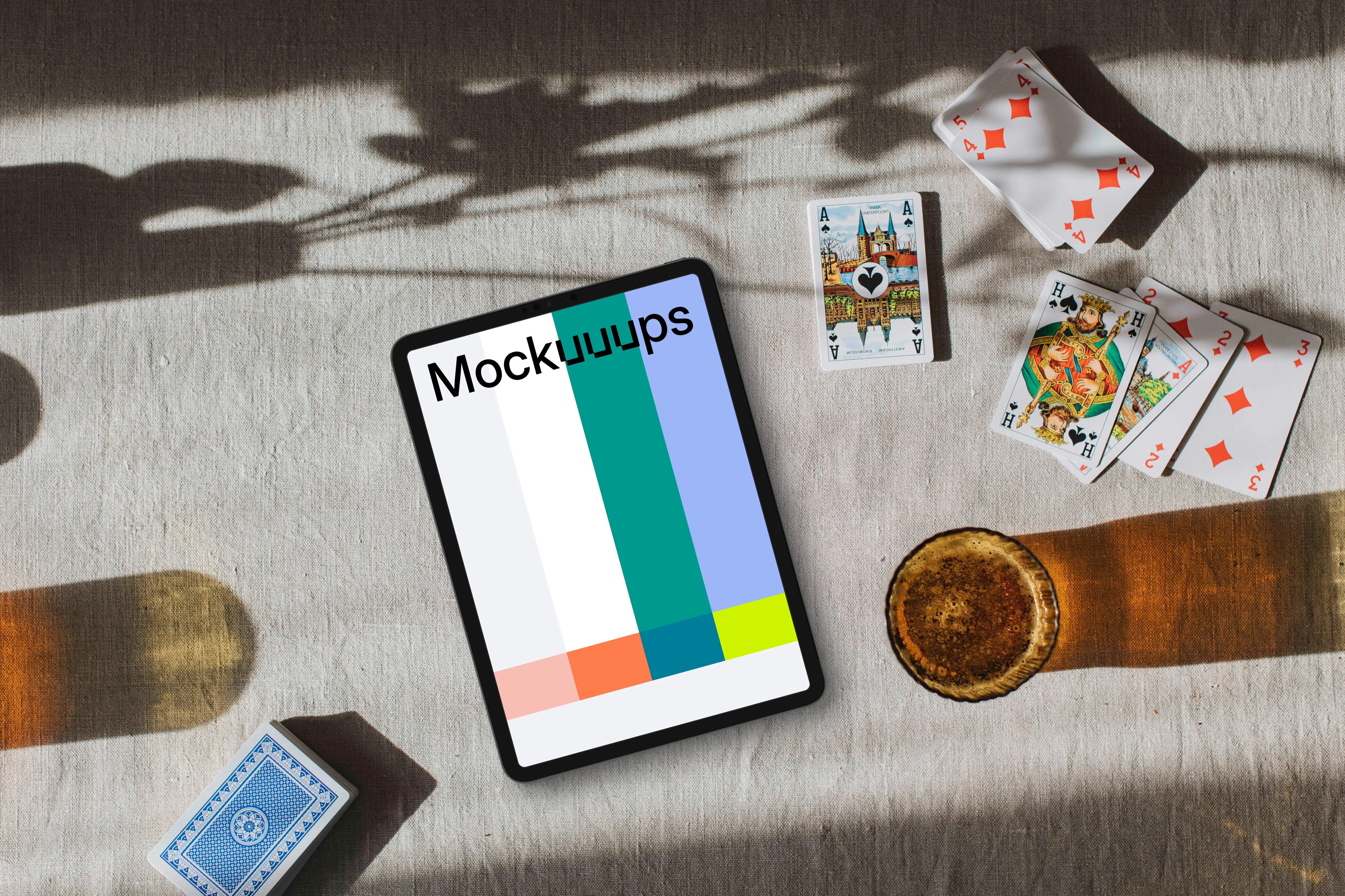 Tablet mockup in the middle of Joker cards