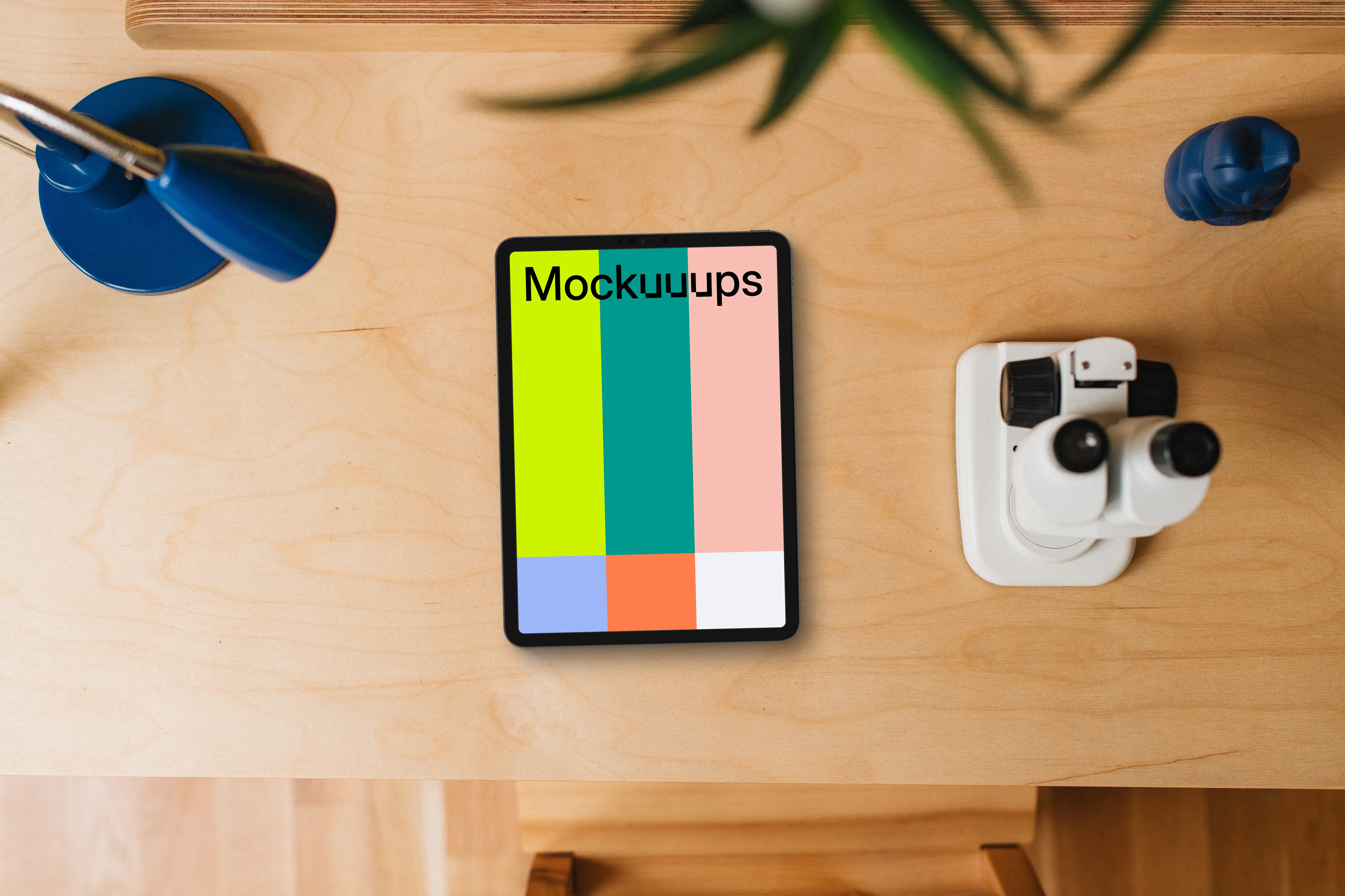 Tablet mockup on a child-friendly desk with educational tools